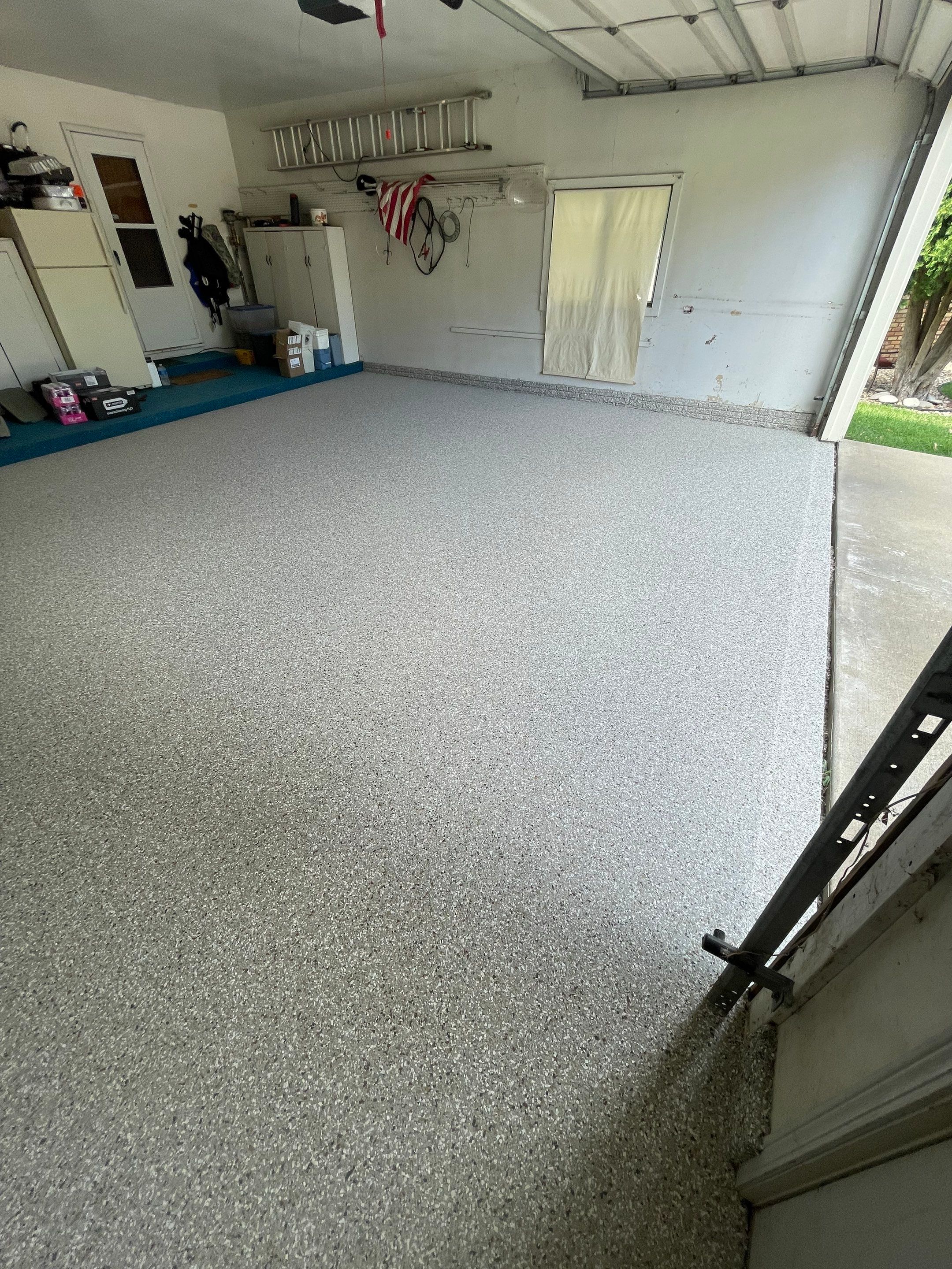 Custom Creekbed Garage Floor Coating in Sioux Falls by Select Painting, Coatings & Garage Cabinets