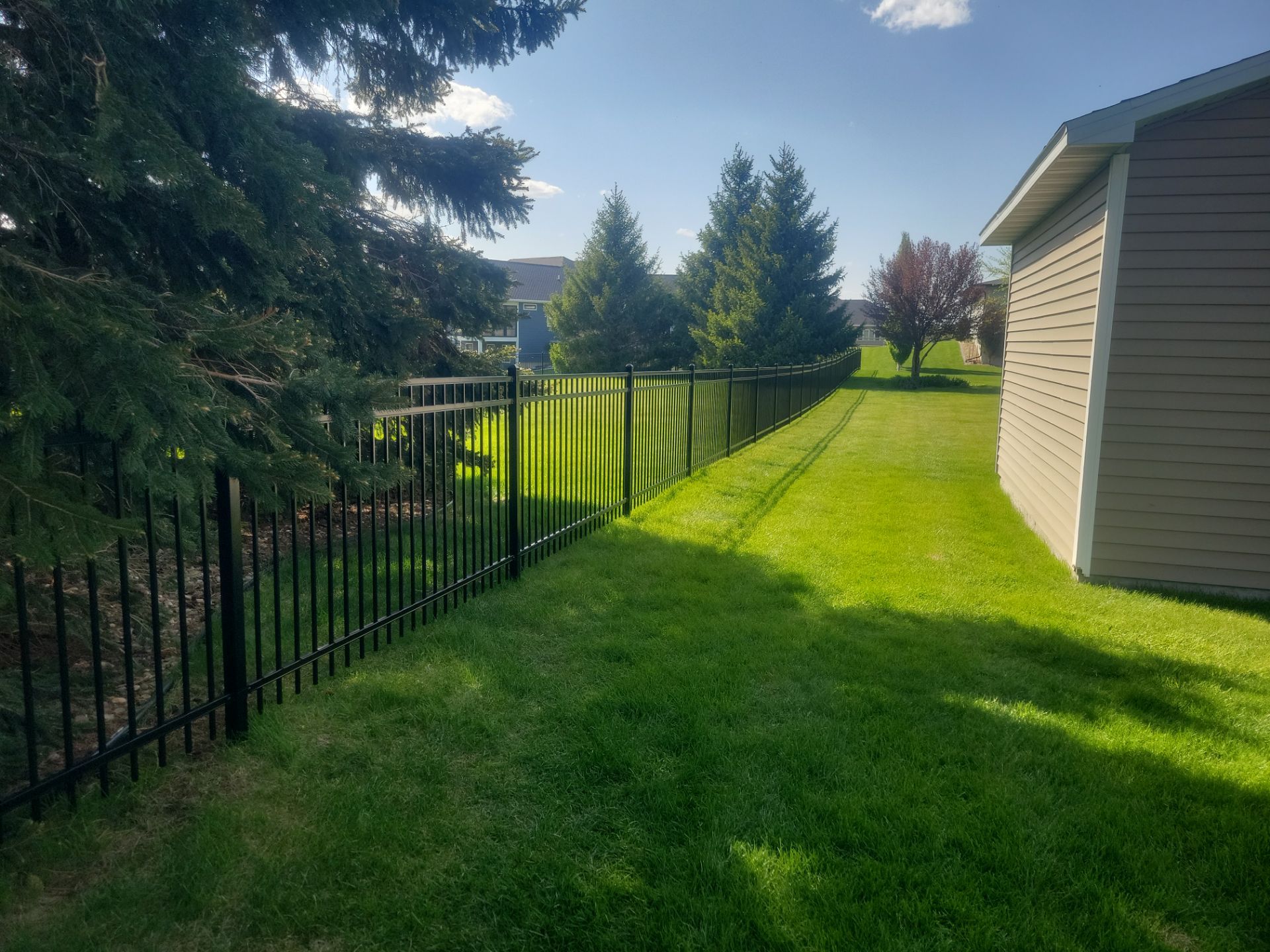 Black Ornamental Metal Picket Fence Installation in Waterloo by Perfect Picket Fence and Stain