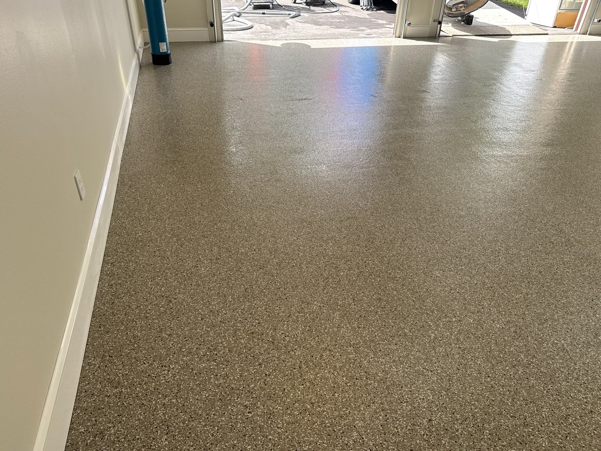 Garage and Sidewalk Project in Keystone Heights, FL in Pebble Beach by Cross Creek Concrete Coatings