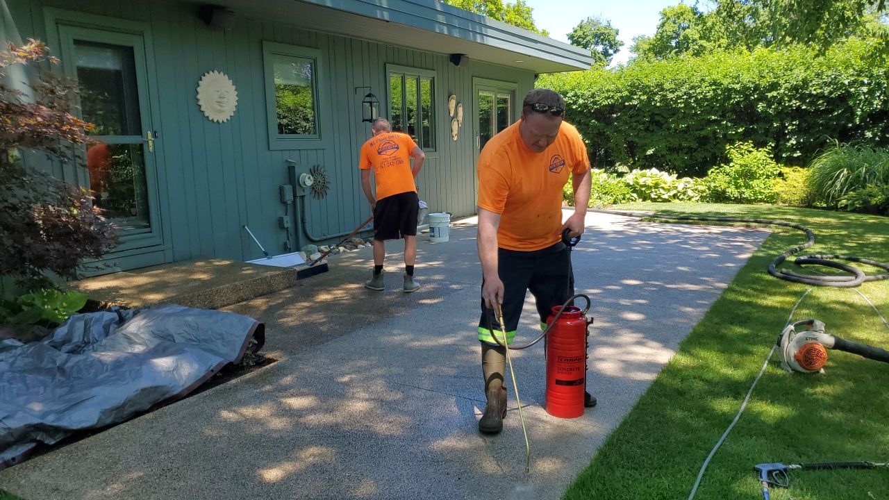 Aggregate concrete cleaning and sealing using Surebond SB-9000 by Northern Power Washing LLC.