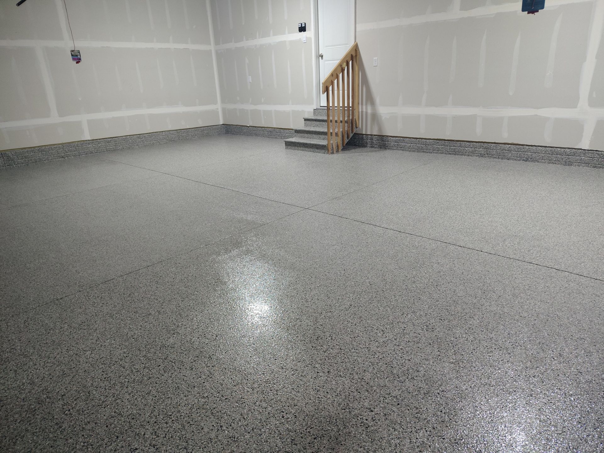 Adel, IA Garage: Complete Keystone Wrap on Floors, Stairs, and Stem Walls by Revival Concrete Coatings