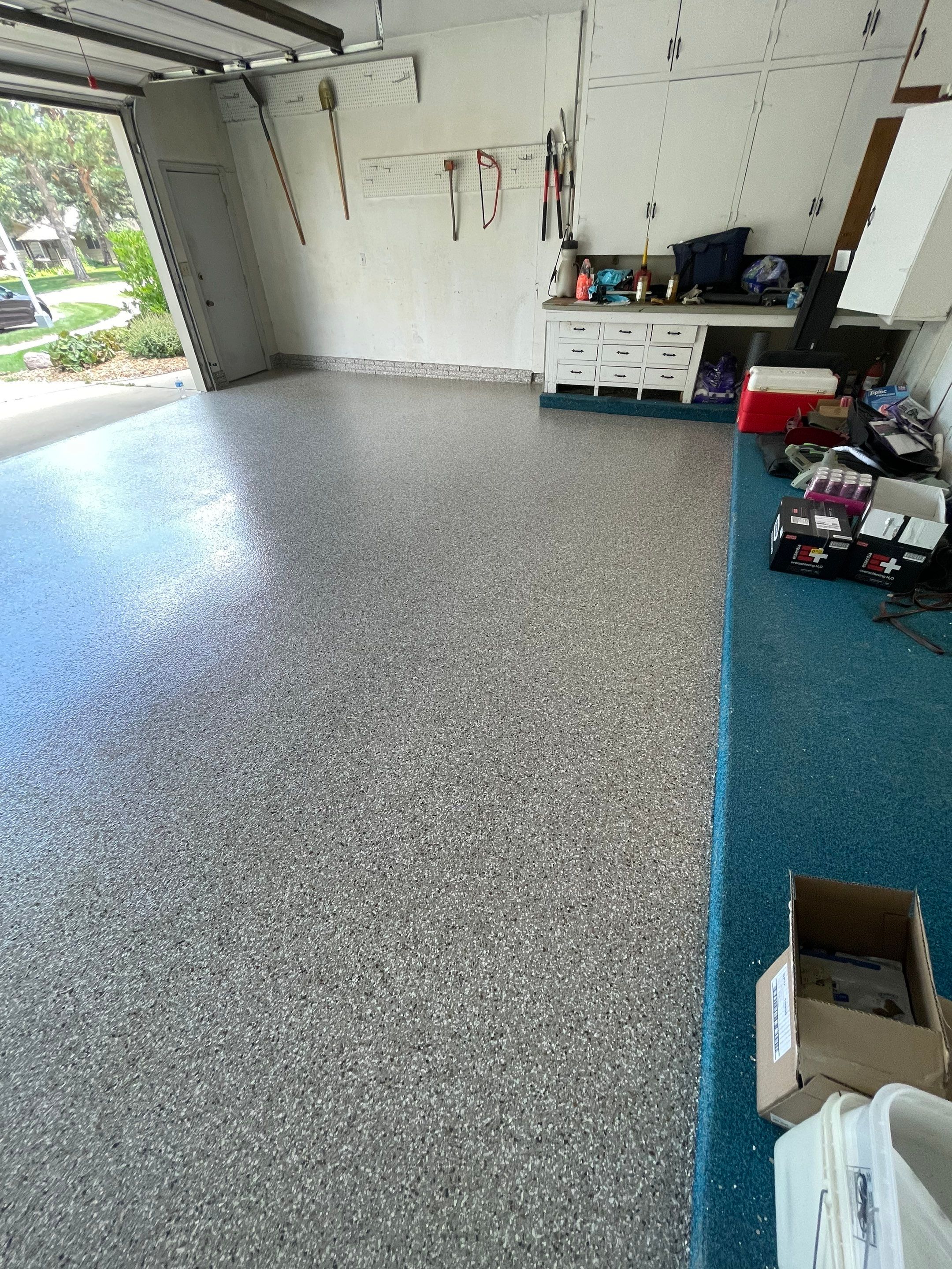 Custom Creekbed Garage Floor Coating in Sioux Falls by Select Painting, Coatings & Garage Cabinets