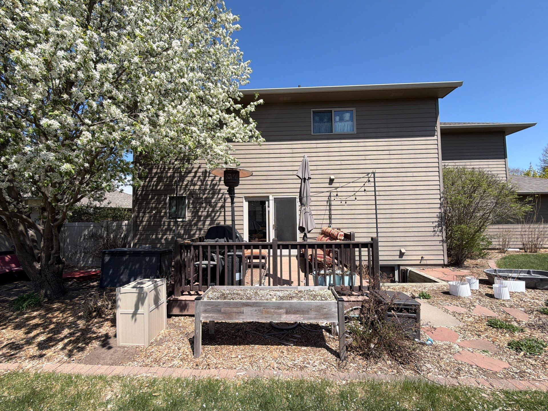 Residential Exterior Painting with Shutter and Trim Updates in Sioux Falls by Select Painting, Coatings & Garage Cabinets