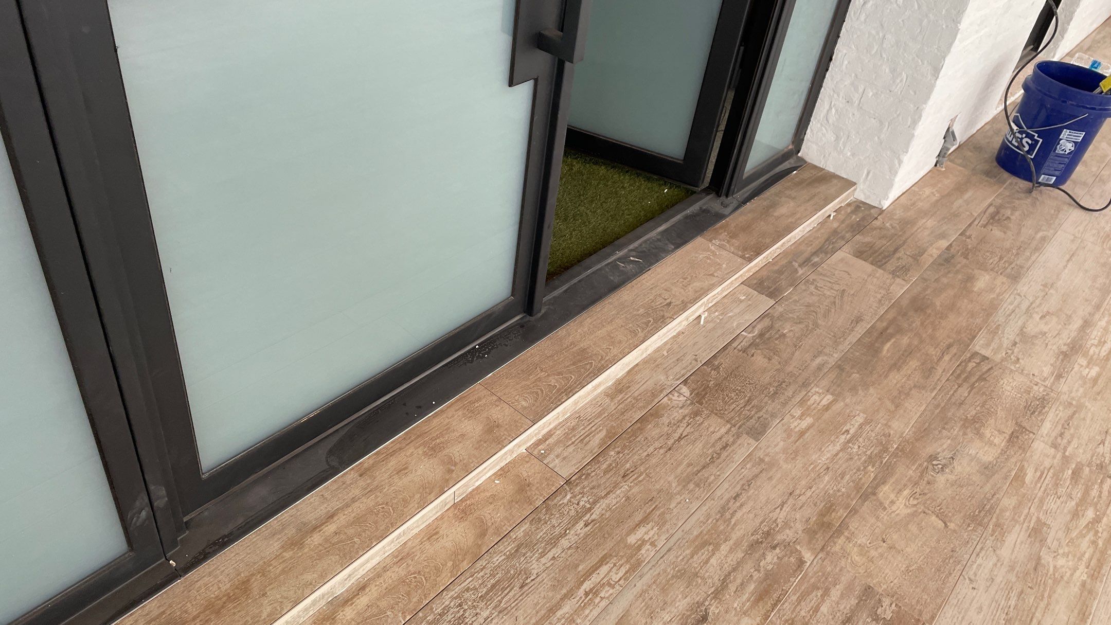 Instant Transformation of this Beautiful Sunroom by Footprints Floors of Coastal Carolina