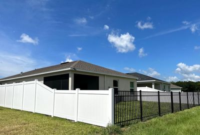 Vinyl Fence Installation using White Vinyl Privacy and 3 Rail Aluminum Fence