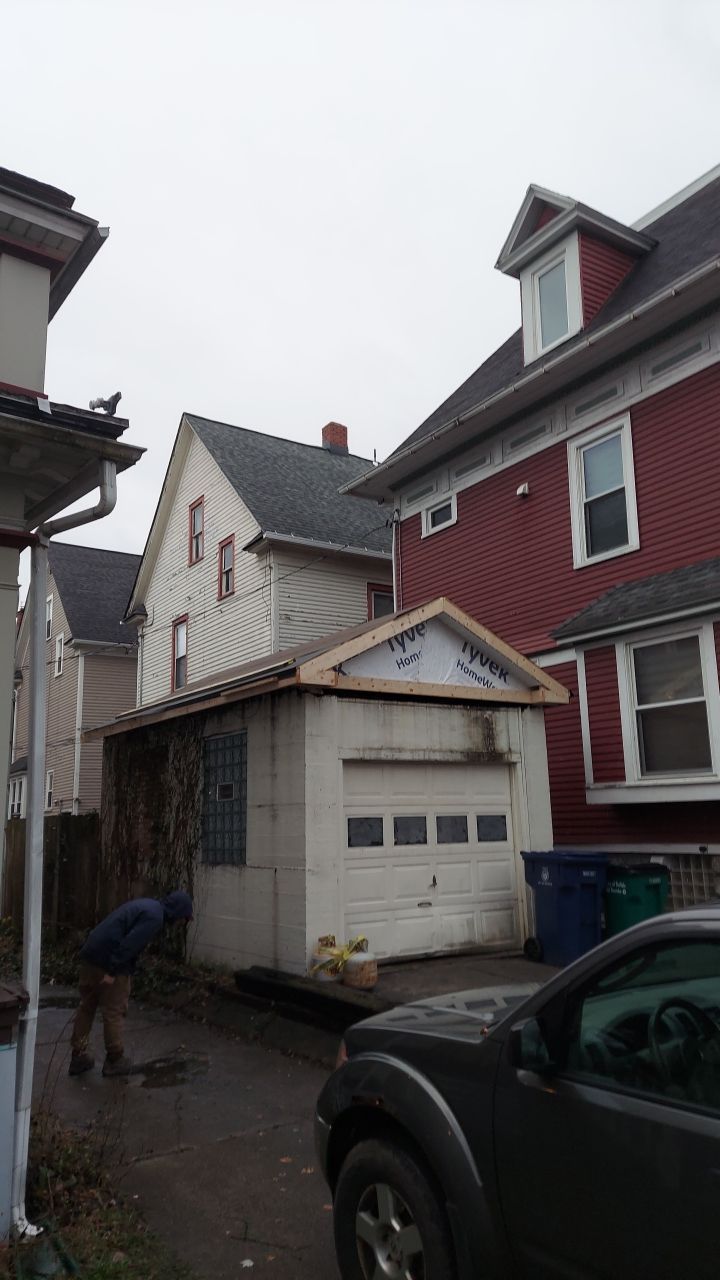 Exterior Renovations- Siding, Stamped Concrete, Porch, and Railings by Ivy Lea Construction