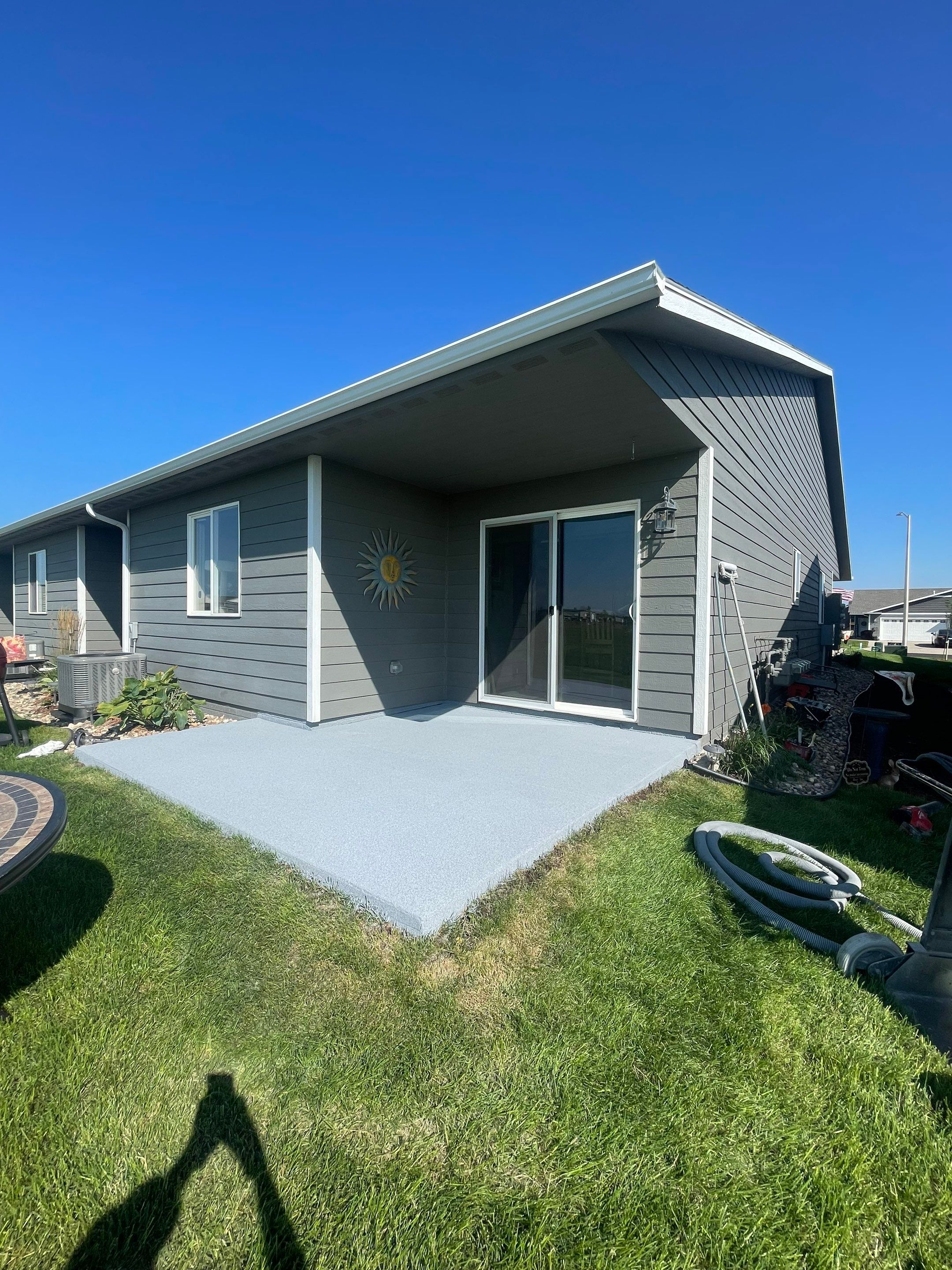 Starry Evening Concrete Patio Coating Installation in Tea by Select Painting, Coatings & Garage Cabinets