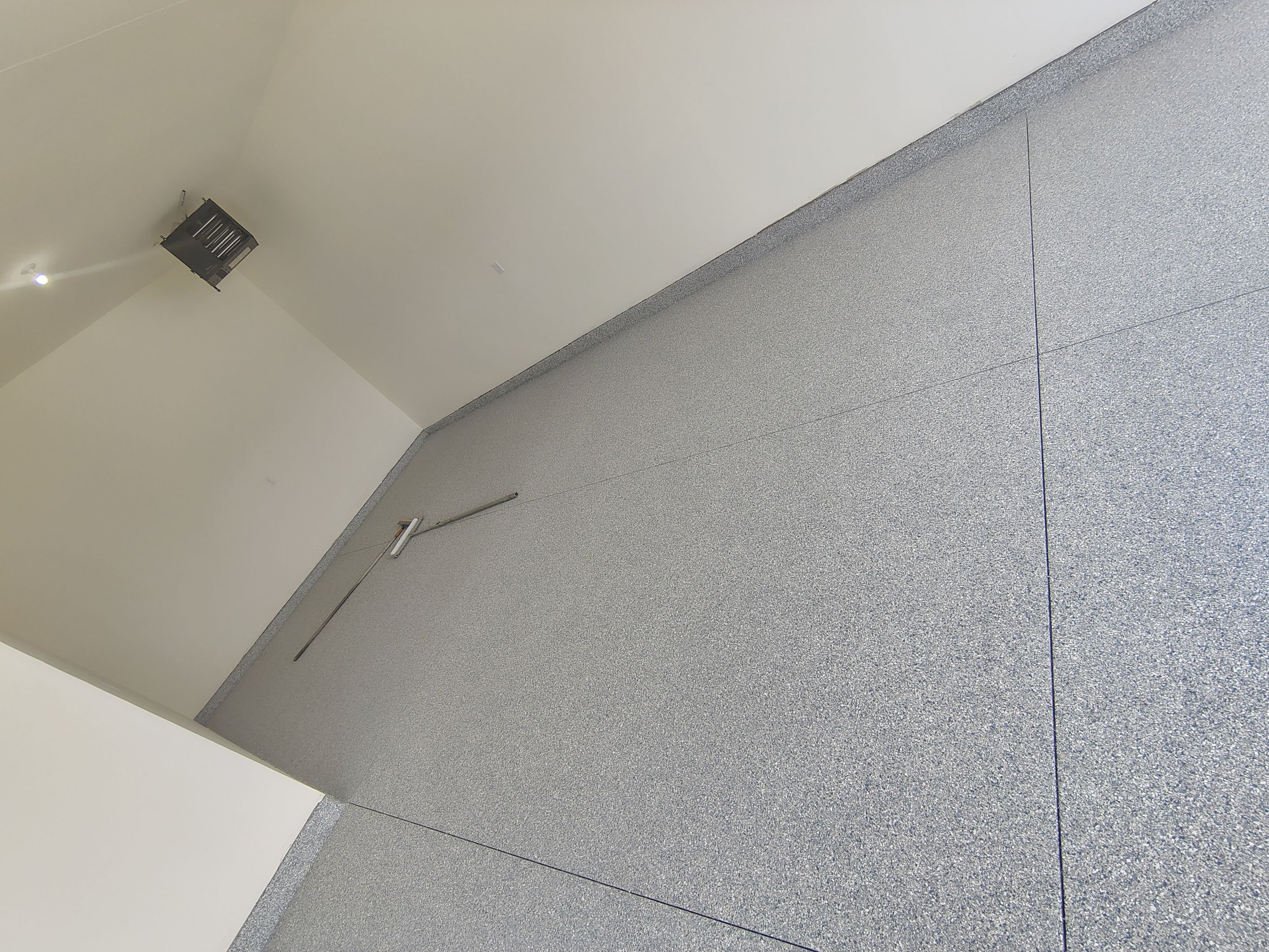 Sioux Falls Garage Floor Transformation with Gray Decorative Flake Coating by Select Painting, Coatings & Garage Cabinets