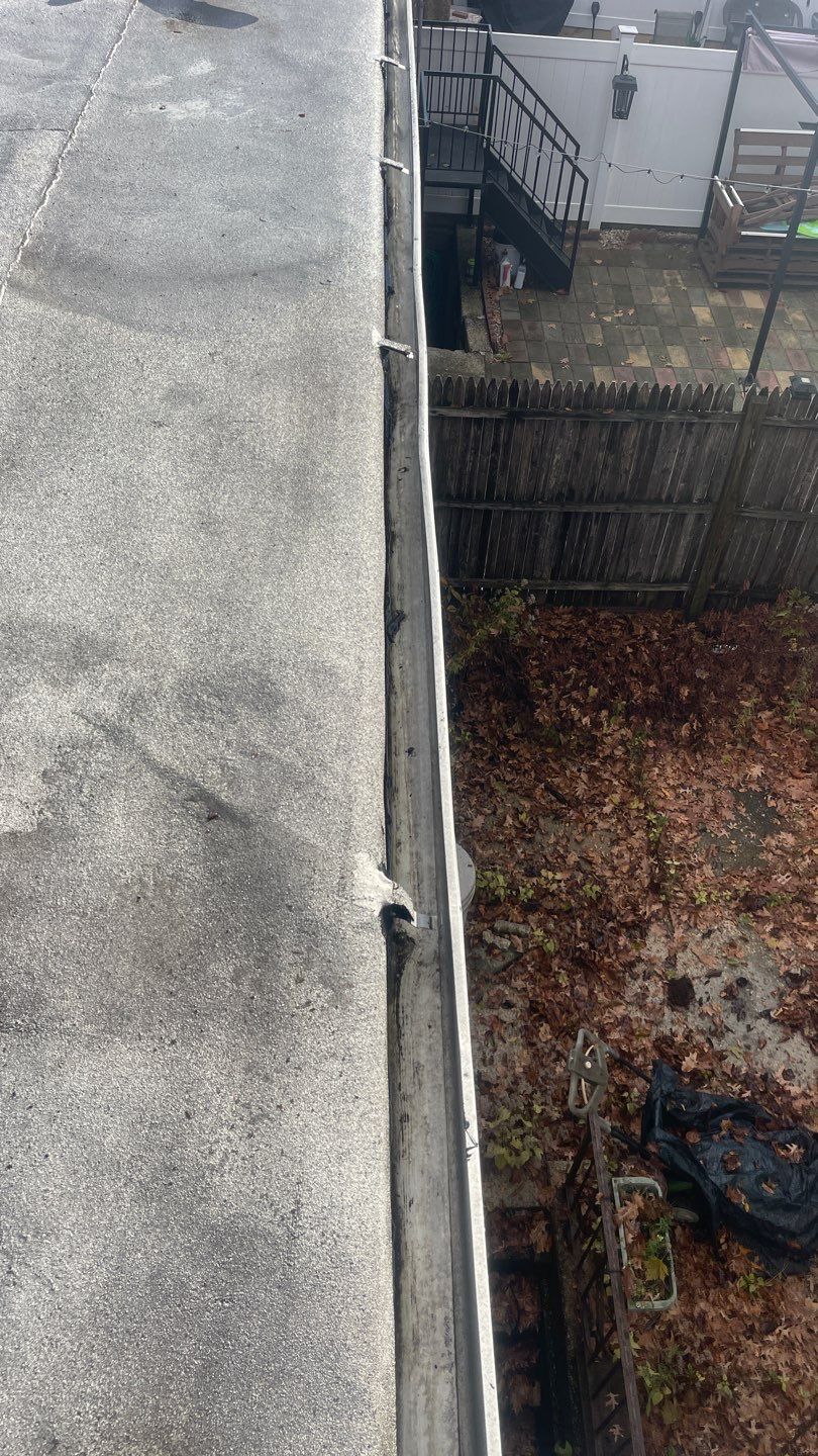 Flat Roof Cleanup and gutter cleaning.  by Above All Gutters 