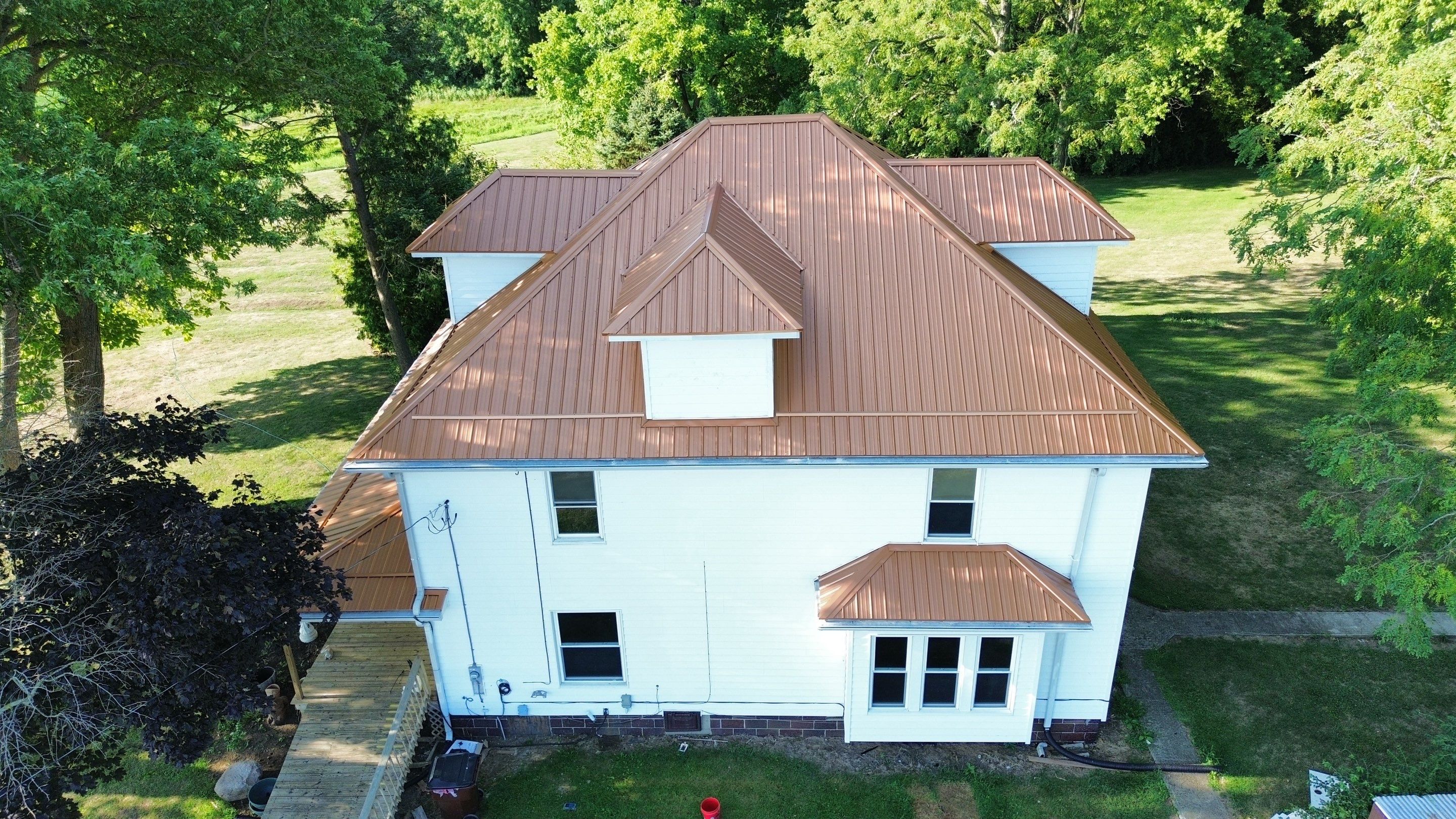 Residential Roofing Installation using Performance Panel Metal - Copper Metallic by RoofX 