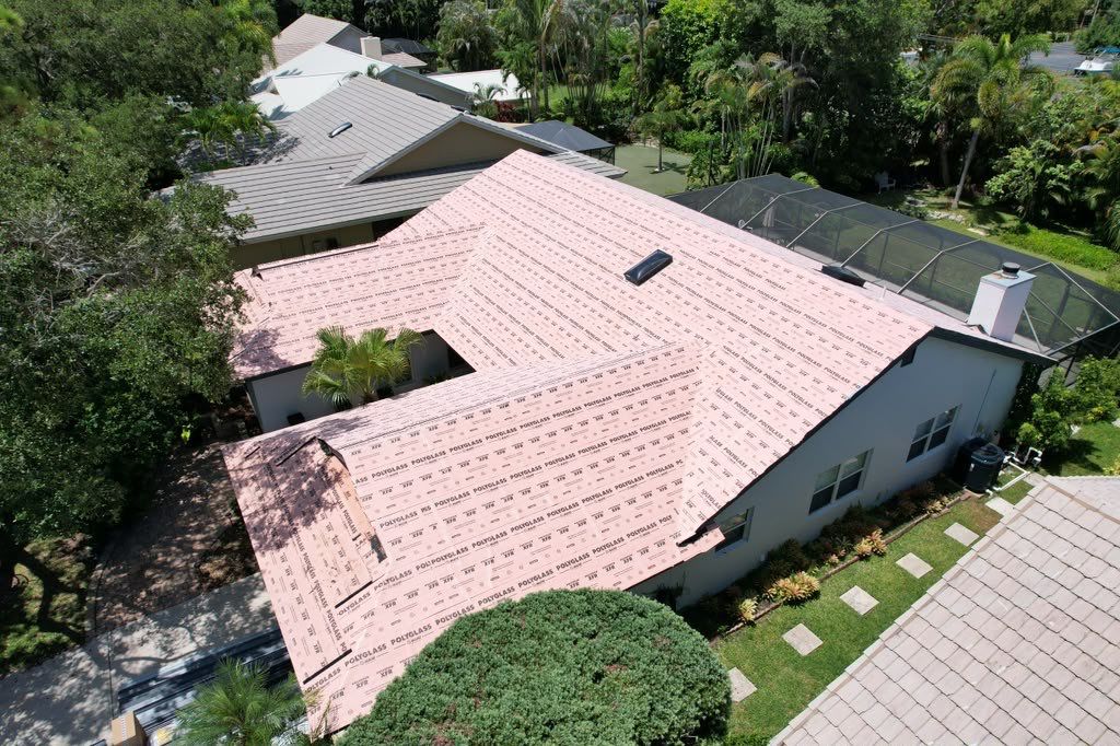 Standing Seam Metal Charcoal Grey Roof Replacement and Skylight Installation in Jupiter by Art's Roofing & Construction