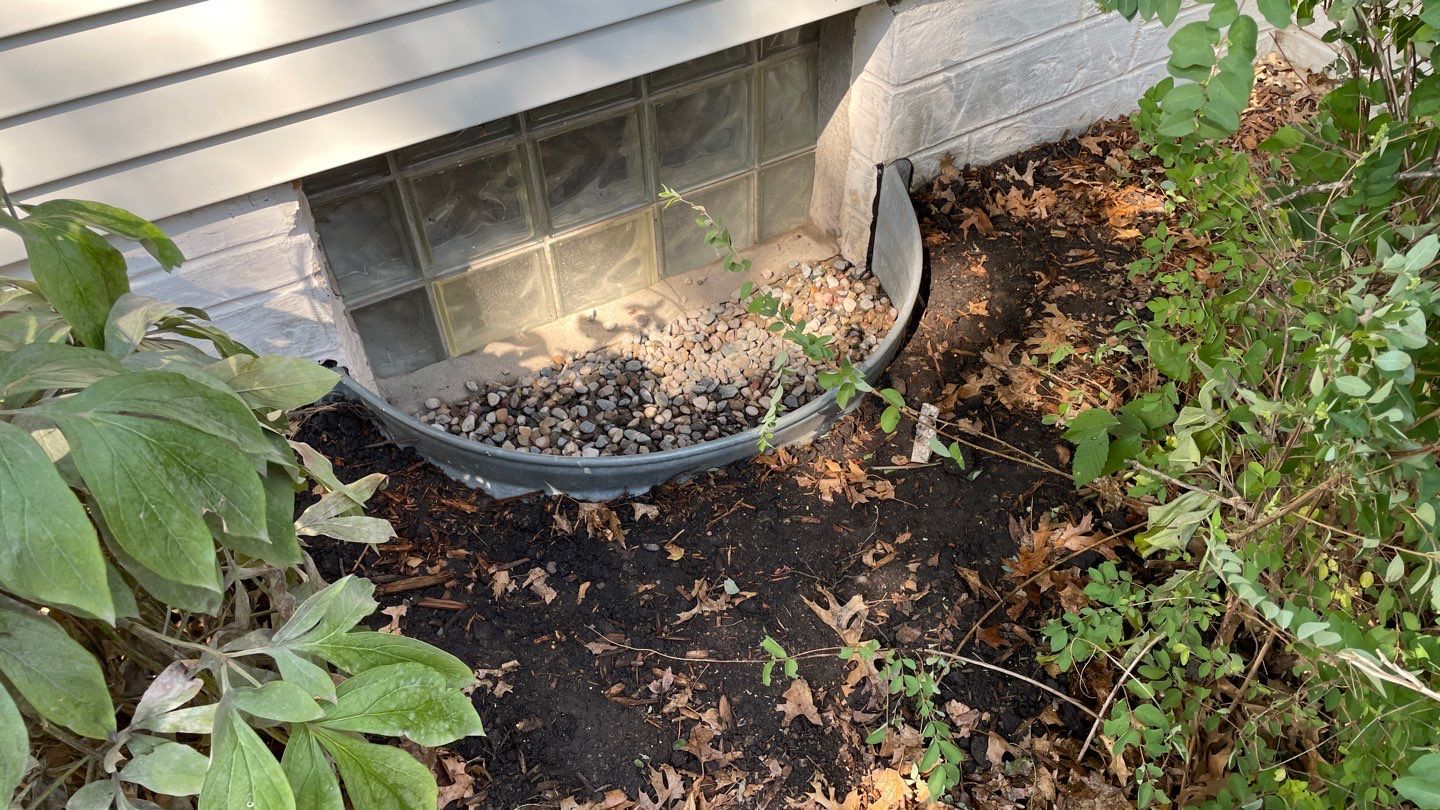 Drain Tile, Window Wells & Buried Discharge in Minneapolis by Waterproofing Northeast