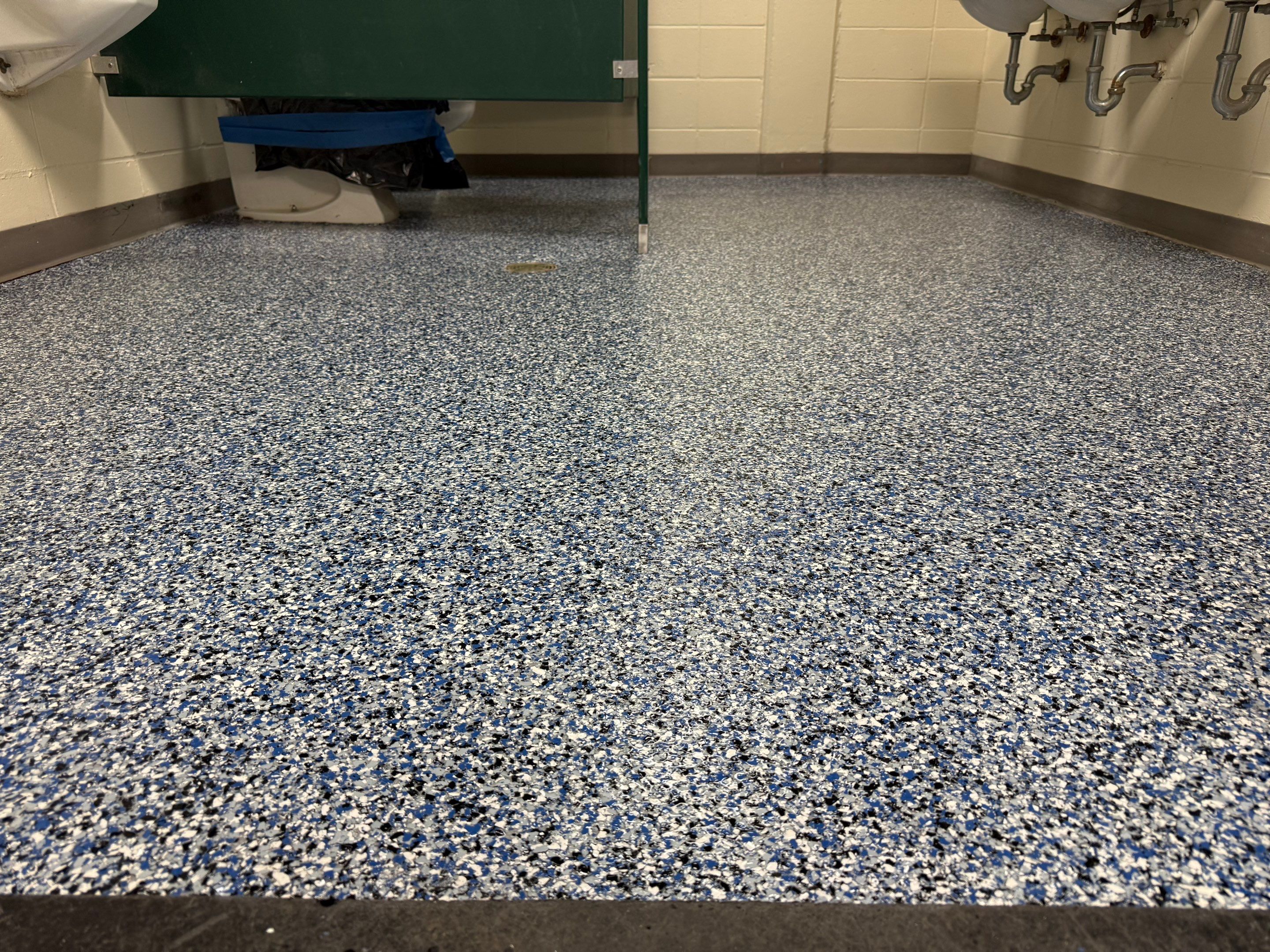 Seamless Epoxy Floor Coating at the Sioux Falls Canaries Facility by Select Painting, Coatings & Garage Cabinets