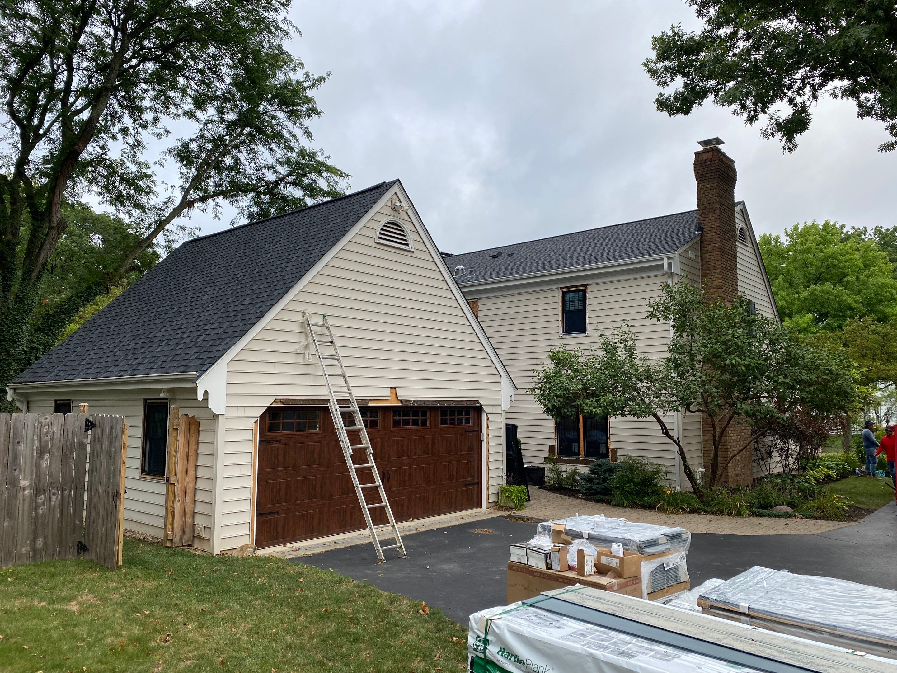 Residential Roofing Installation using James Hardie Fiber Cement Lap Siding and Certainteed Landmark Pro Shingles by Best Exteriors Inc