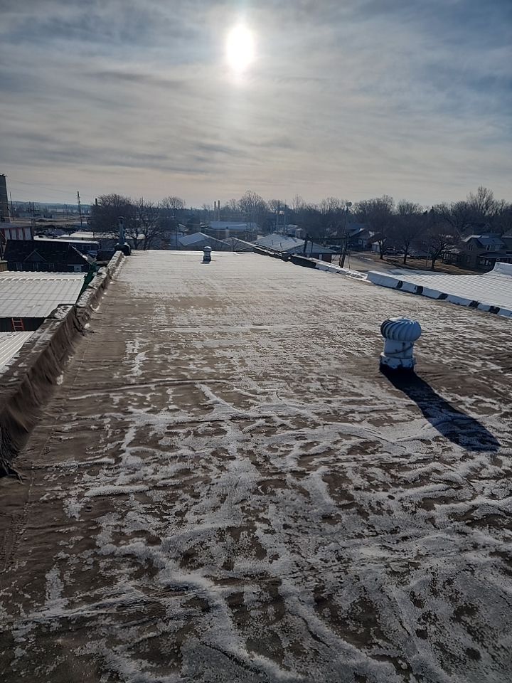 Recover of a downtown building  by Grell Roofing, LLC