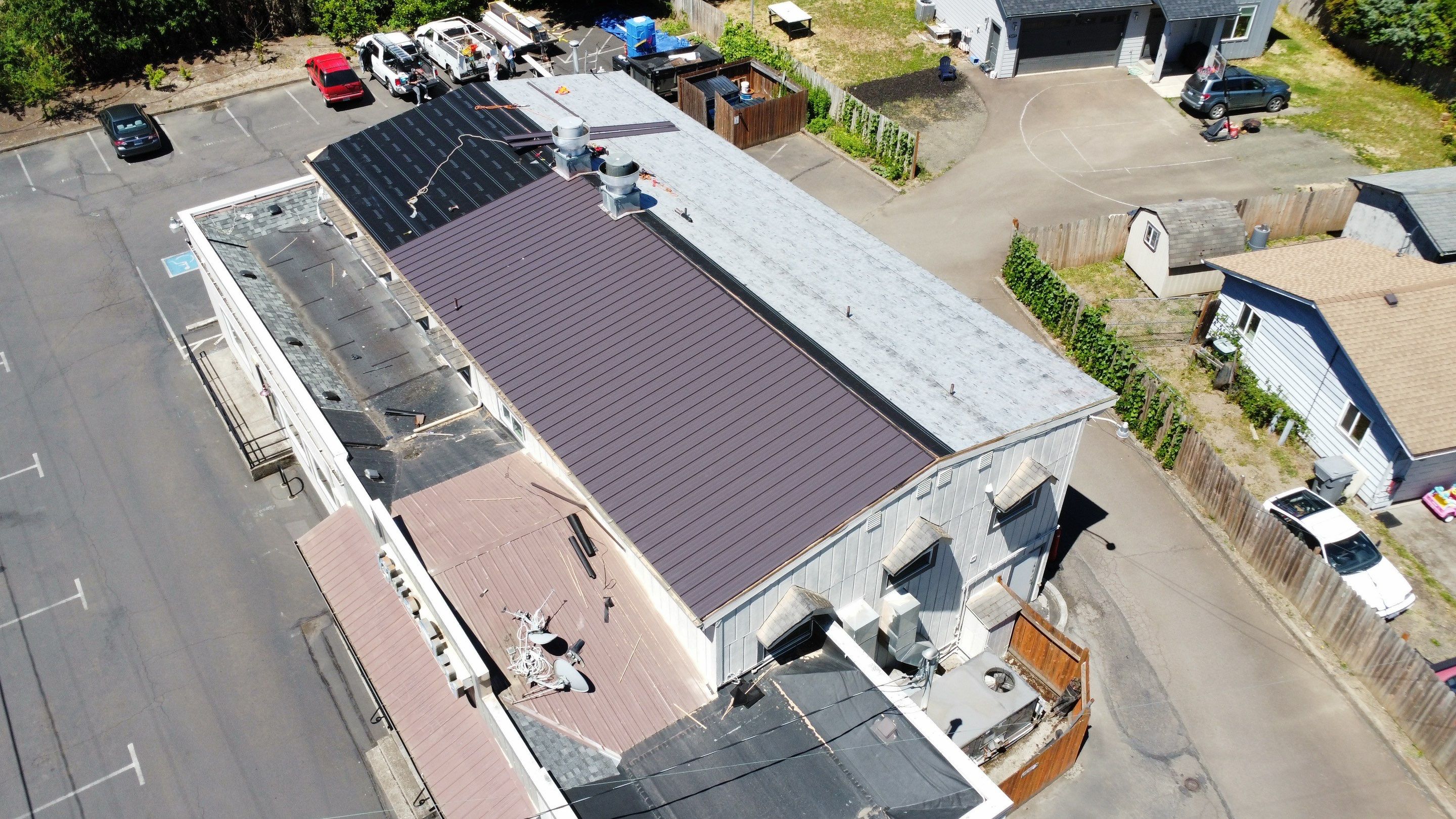 Commercial Flat Roof Installation using Bruce and Dana Snap Lock Metal (Color: Brown) by Orezona Building & Roofing Company, Inc.
