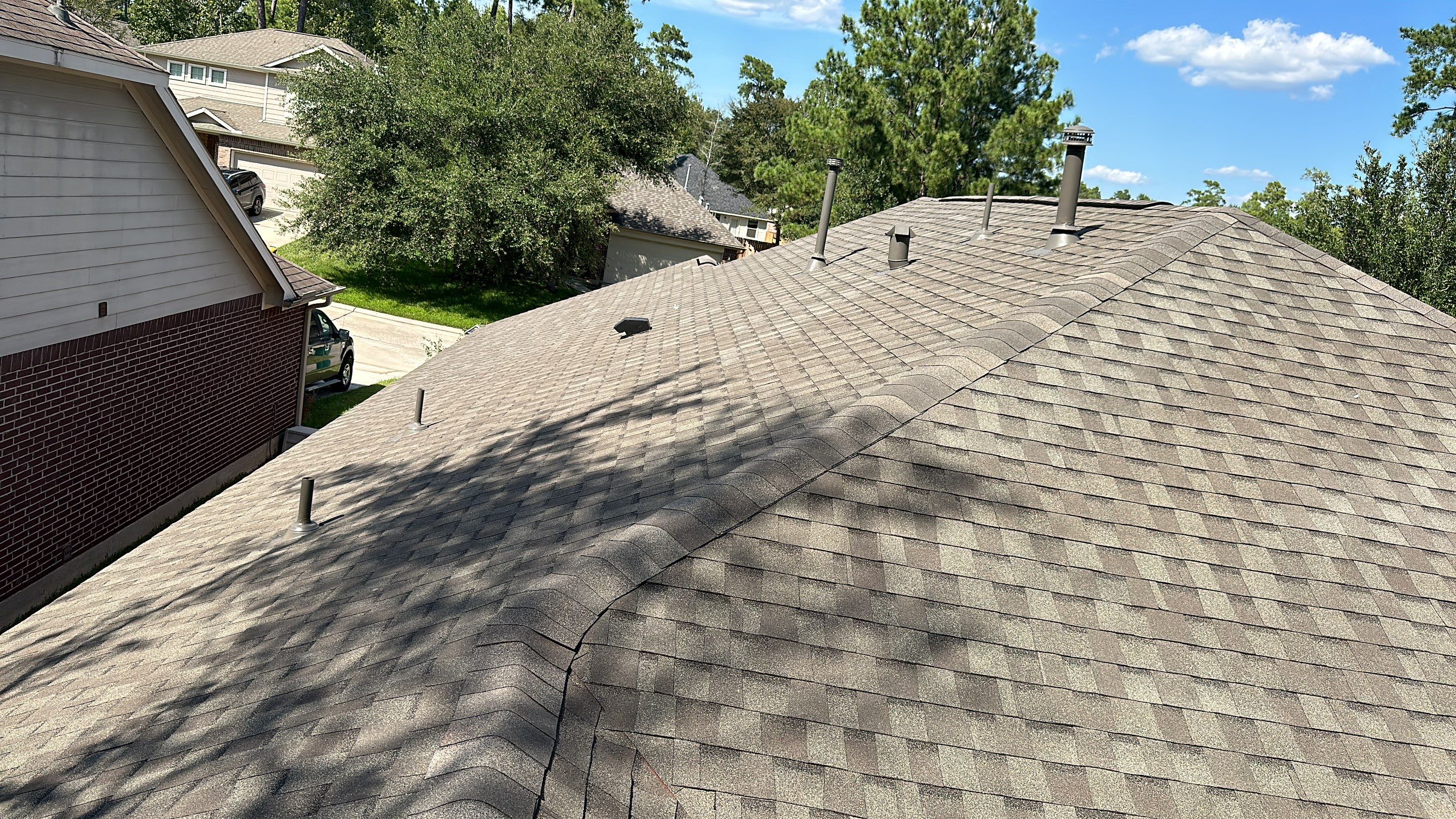 Roof Replacement on a Wooded Lot — Spring, TX by PL Roofing & SB Roofing, LLC.