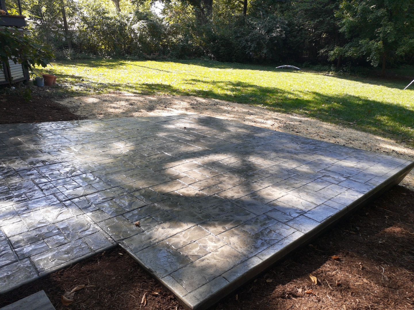 Back Yard Cantilivered Patio by LAND ESCAPES LLC