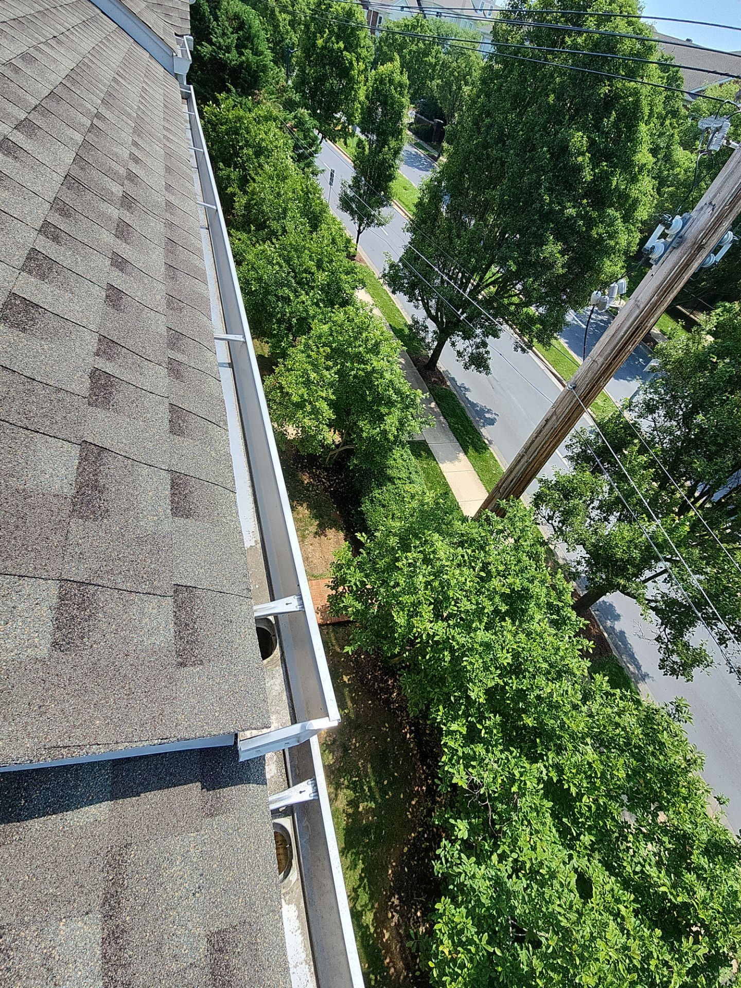 HOA gutter cleaning in Winchester, VA, after  photo showing full gutters.