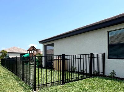 Aluminum Fence Installation using Black 3 Rail Aluminum Fence
