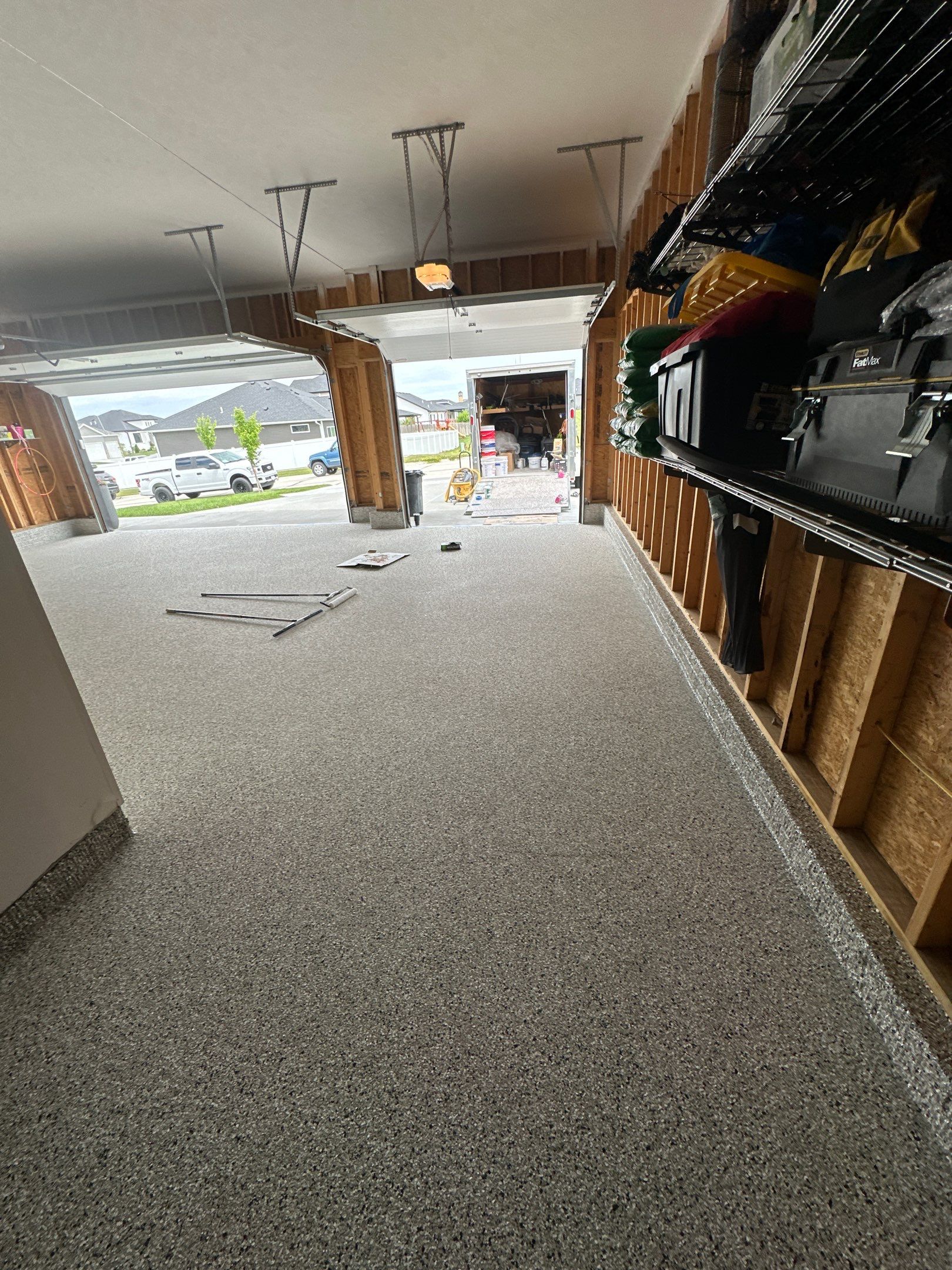 Three-Stall Garage Epoxy Floor Coating Installation in Lincoln by Goat Coatings