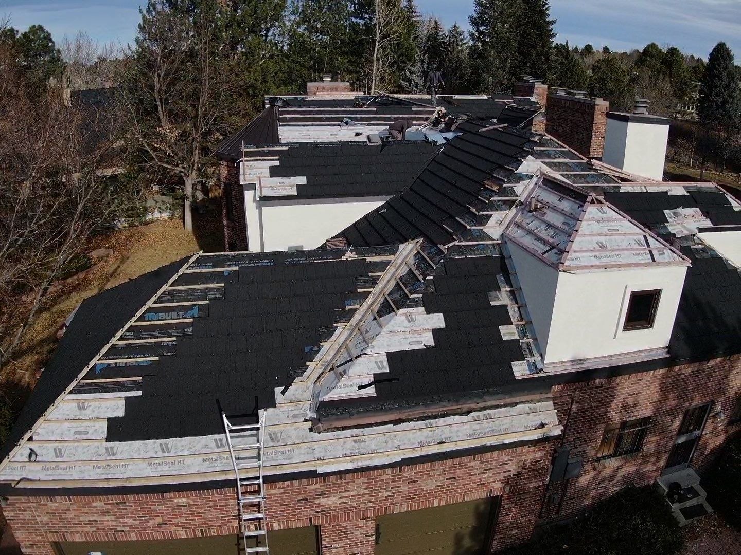Unified Stone Coated Roof & Stucco Remodle by Blue Peaks Roofing LLC