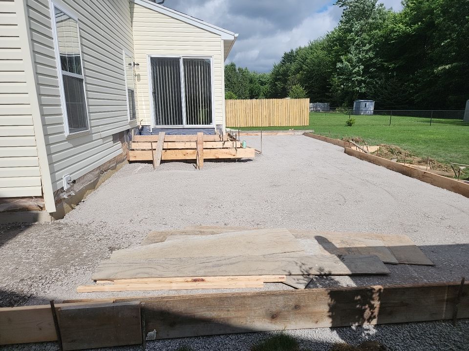 Stamped Concrete, Entry Door, and Concrete  by Ivy Lea Construction
