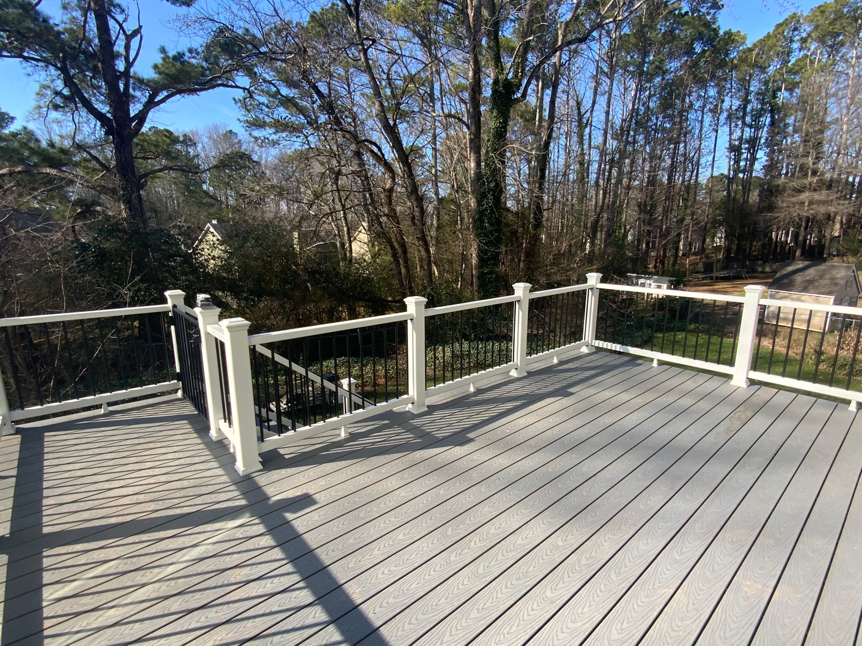 Elevated Grey Composite Deck Installation in Woodstock, Georgia by Swift Home Renovations