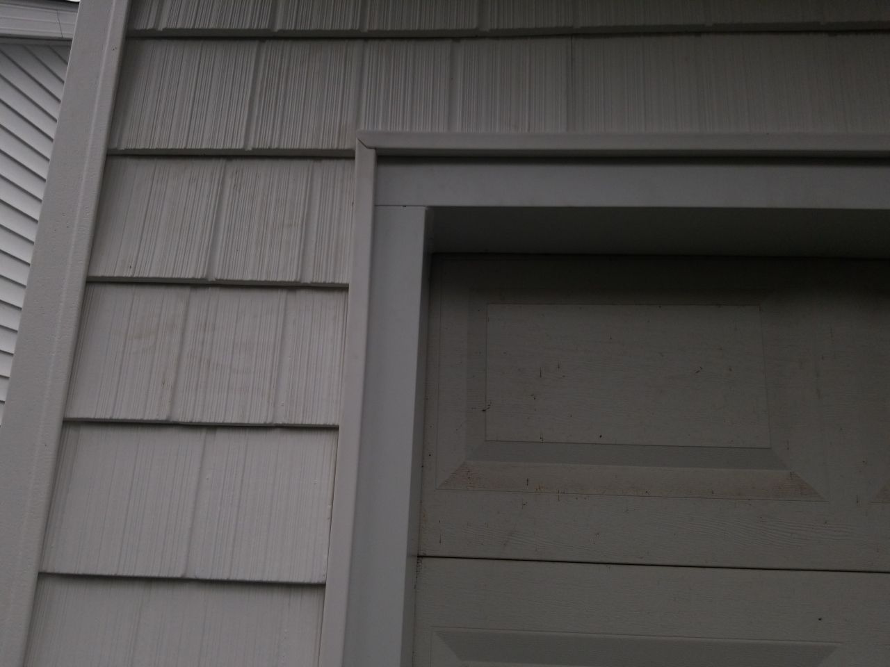 Residential Roofing Installation, Dec-tek walk-out porch roof, siding on garage by Absolute Roofing and Construction