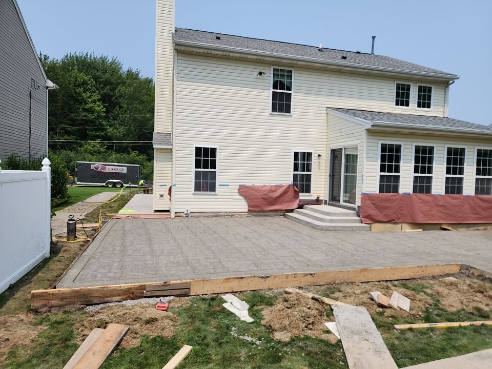 Stamped Concrete, Entry Door, and Concrete  by Ivy Lea Construction