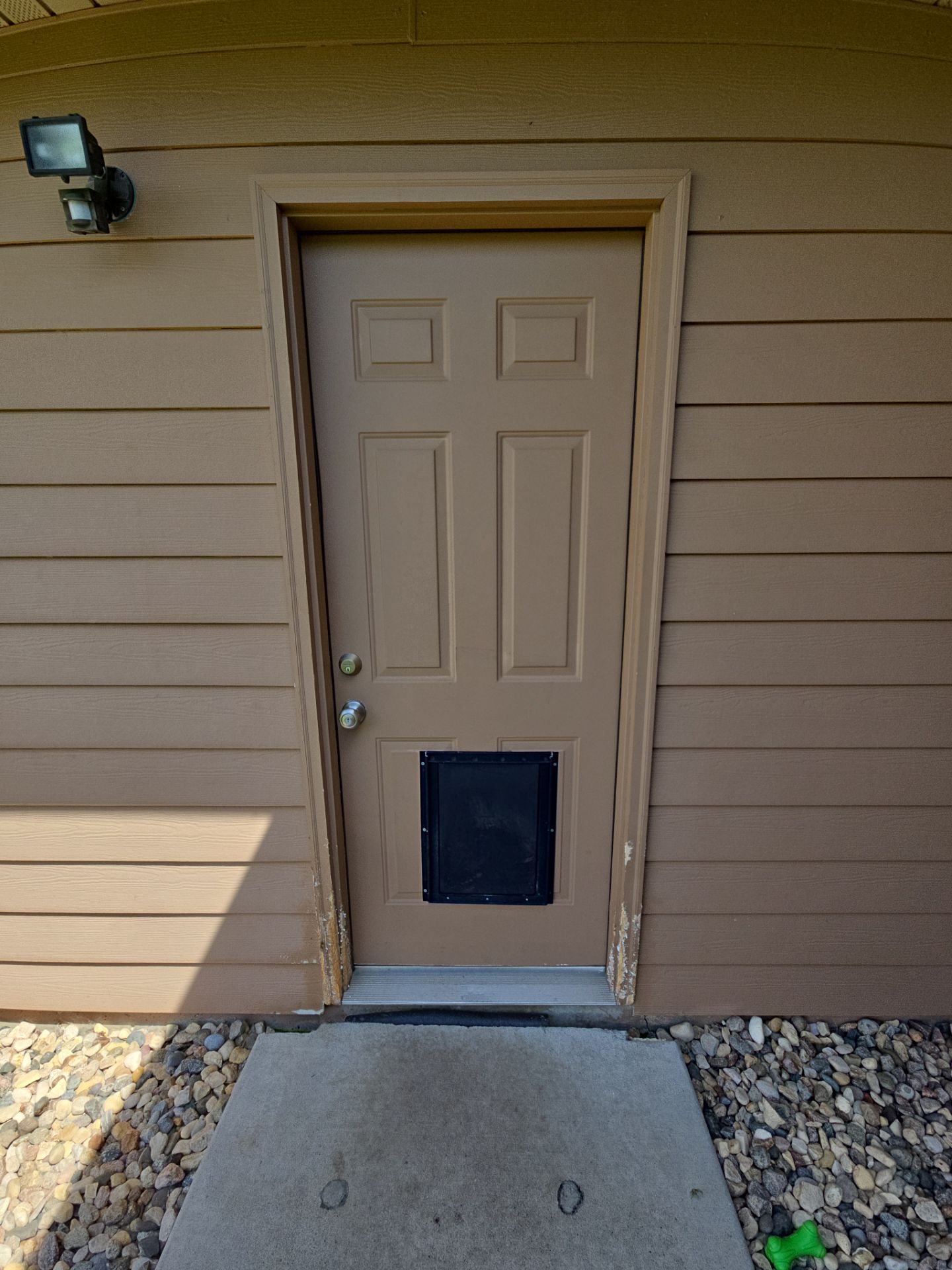 Sioux Falls Residential Exterior Door and Siding Refresh by Select Painting, Coatings & Garage Cabinets