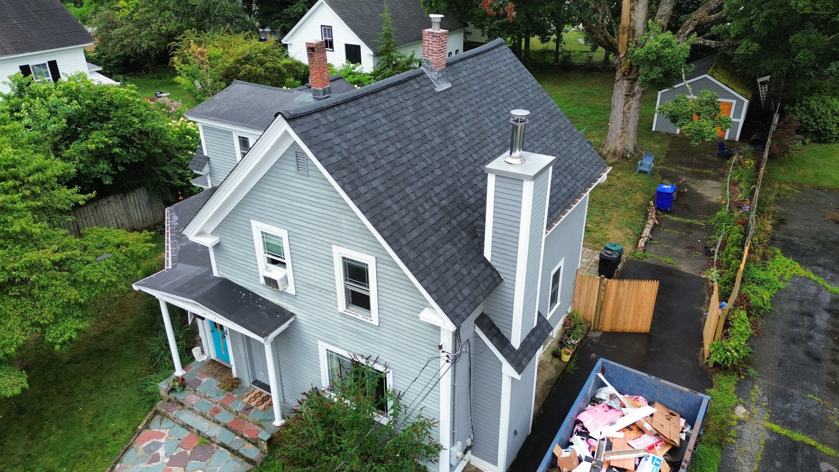 Full Roof Replacement + Custom Gutter Install | Onyx Black Finish by Mighty Dog Roofing of Greater Middlesex County