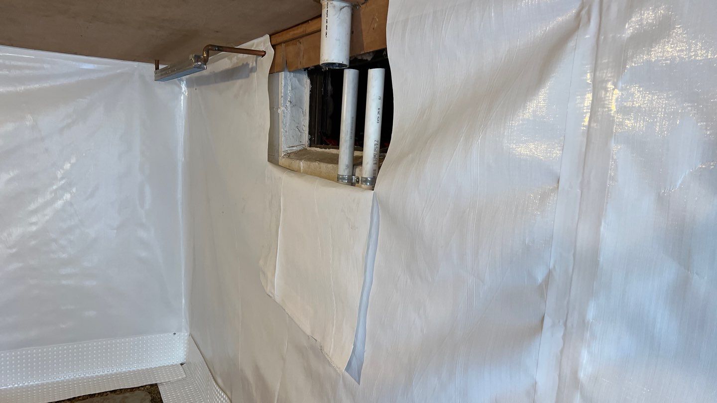 Basement Waterproofing using Drain tile system and a foundation wrap by ACE Waterproofing & Basement Solutions