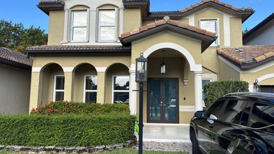New Windows and Doors with a Striking Front Entry Door