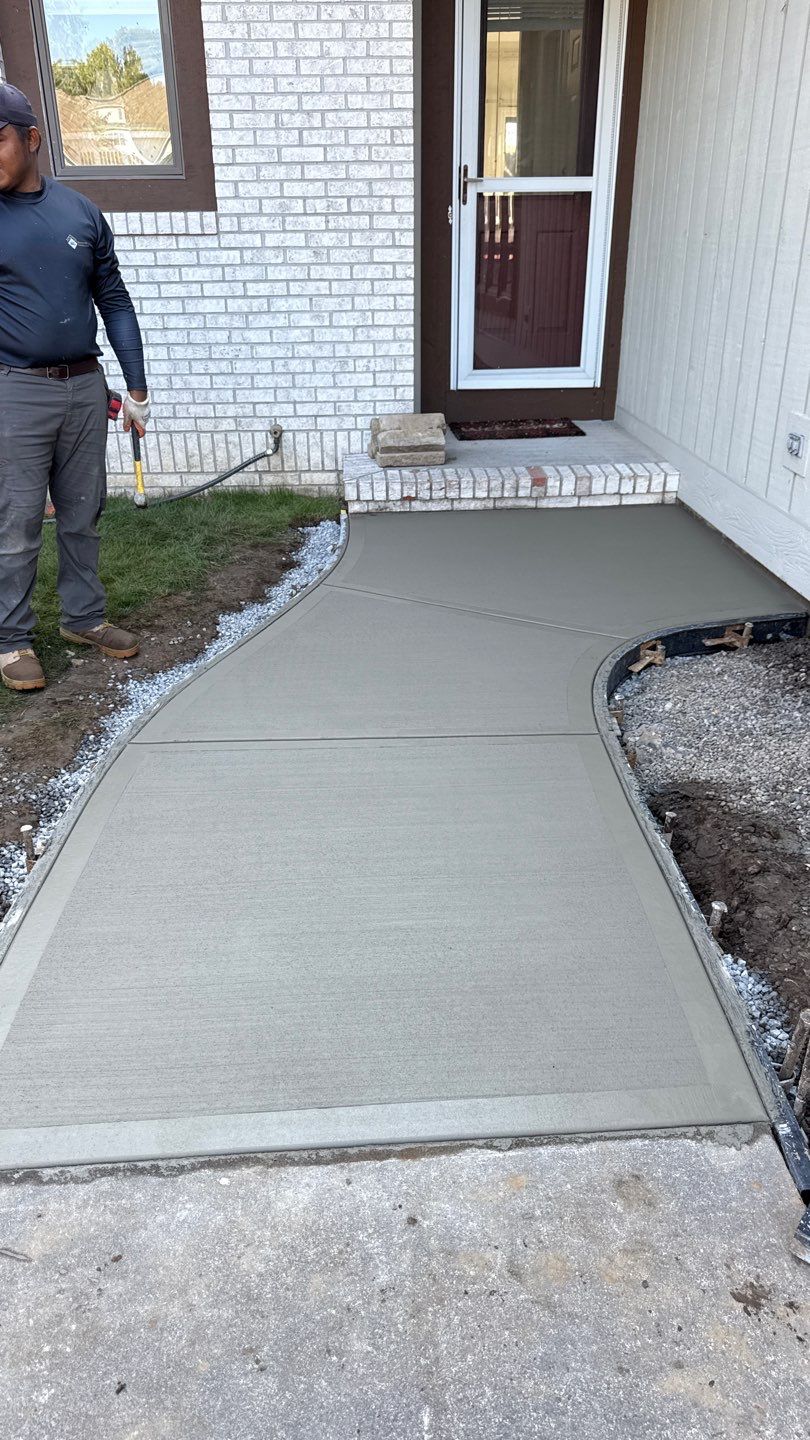 Broom finished concrete patio and walkways  by NG Masonry & Construction LLC