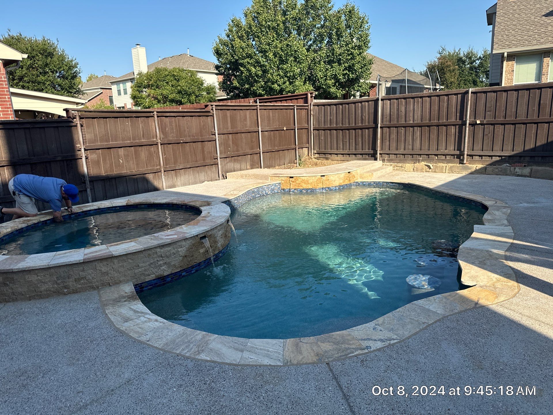 Freeform Pool and Spa with Raised Stone Water Wall by Pinnacle Pools and Spas - DFW