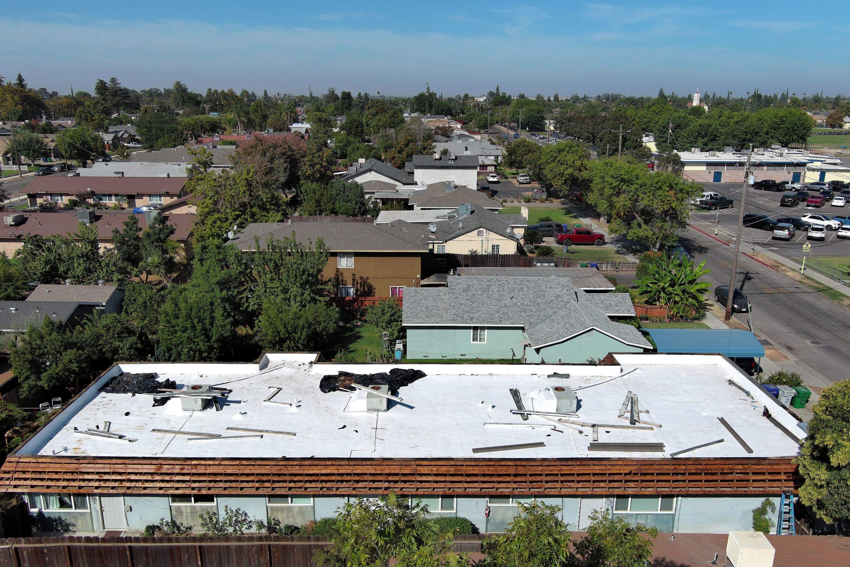 Foam Refurbish using Conklin Benchmark/PUMA XL coatings and spray foam; Also metal roofing around parapet wall by Straight Edge Roofing Inc
