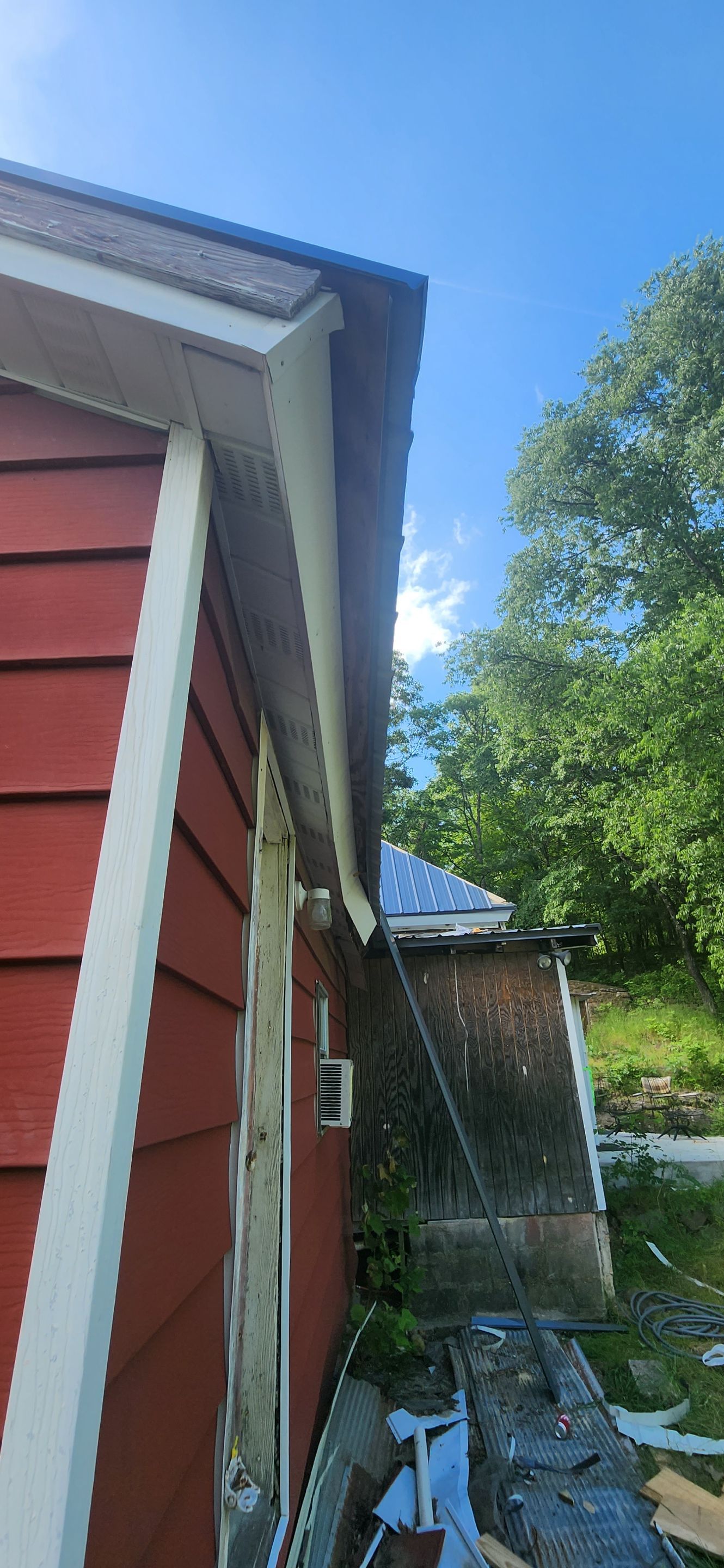 Residential Roofing Installation using 26 Gauge Colored Panels by Hostetler Roofing