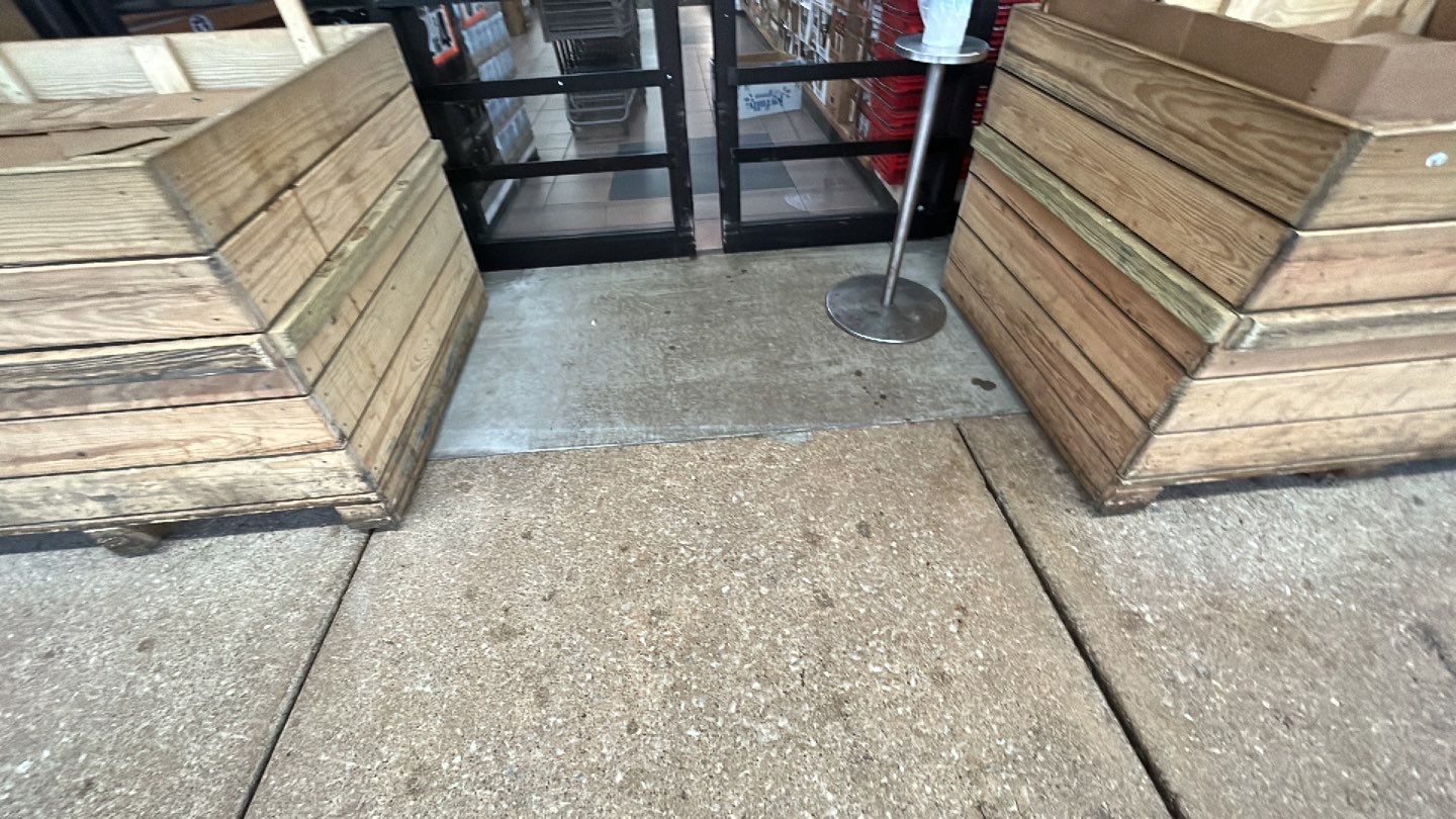 Concrete sidewalk cleaning and degreasing by Northern Power Washing LLC.