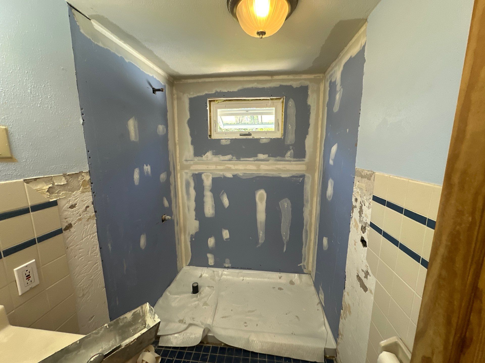 Tub-to-Shower Conversion using Swanstone Carrara by Chagnon Building & Remodeling LLC