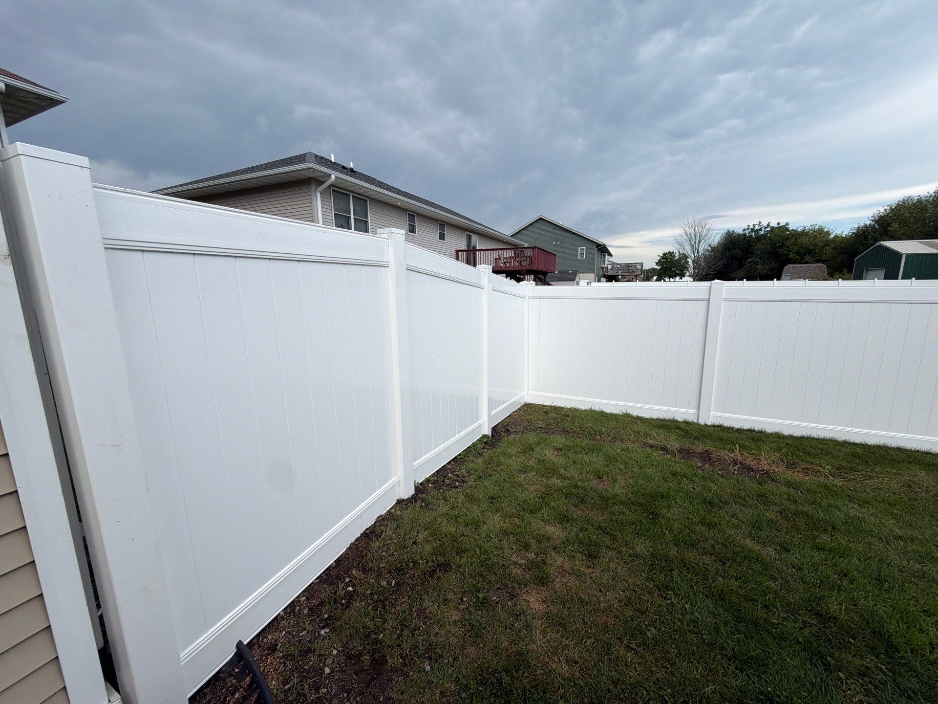 White Vinyl Privacy Fence Installation in Raymond, IA by Perfect Picket Fence and Stain