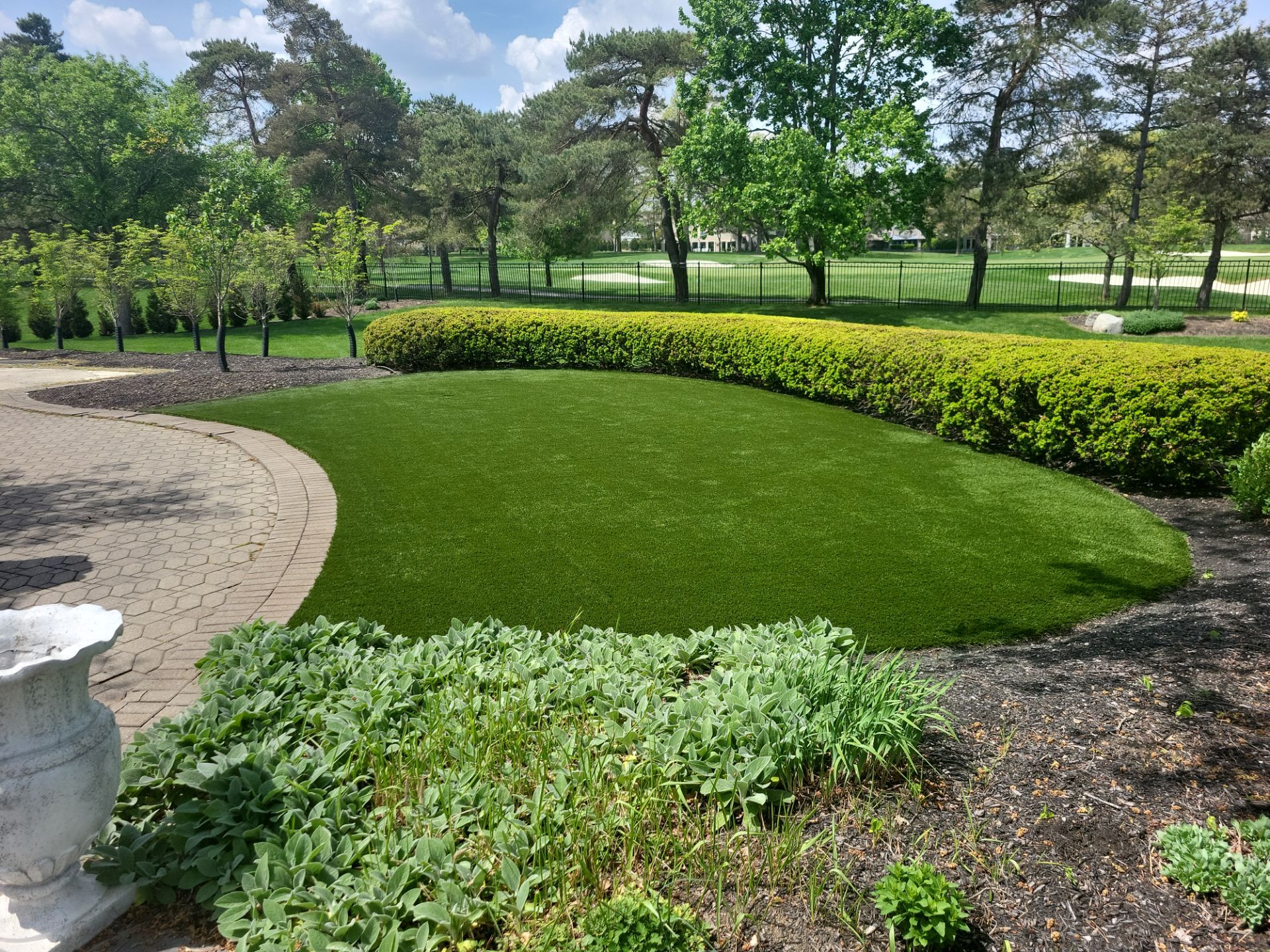 Muirfield Village backyard by Southwest Greens Midwest