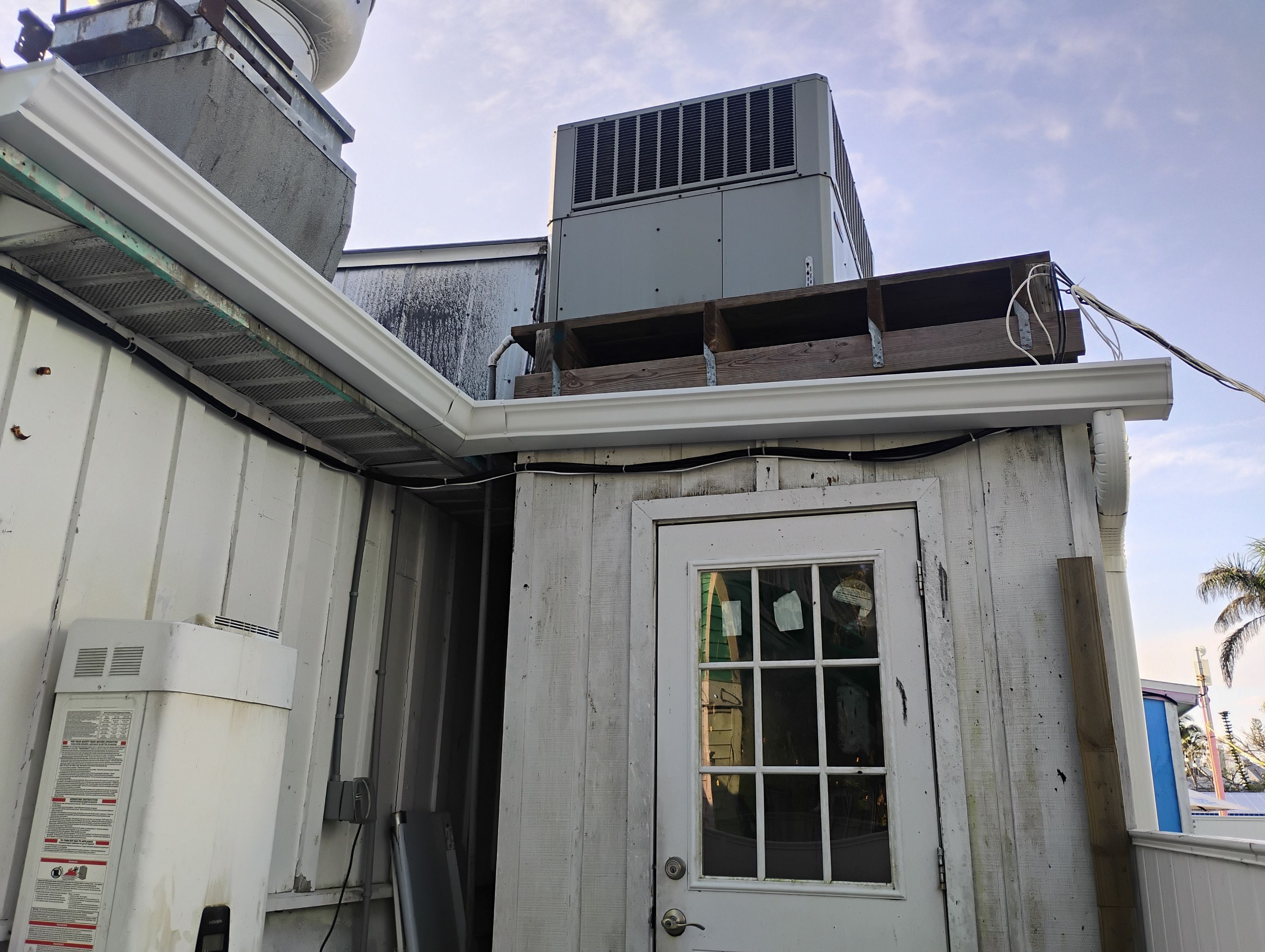 Commercial Downspout Installation in Captiva FL by Gutter Professors