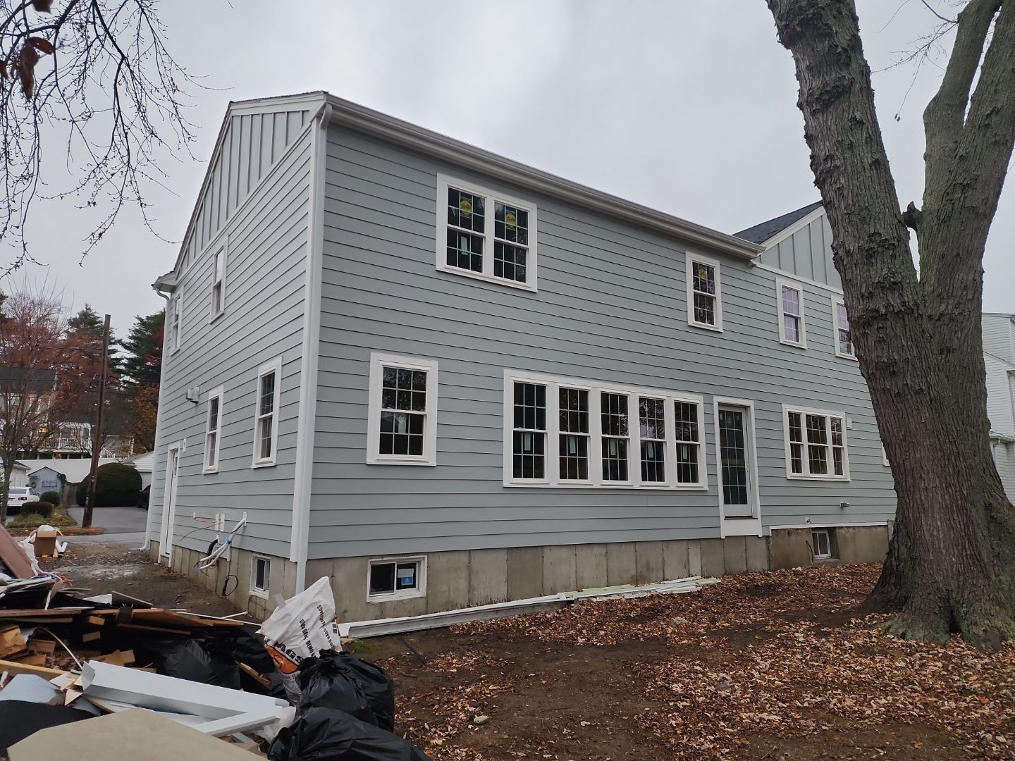 Siding and Roof for house with new addition in Milton, MA by UBrothers Construction