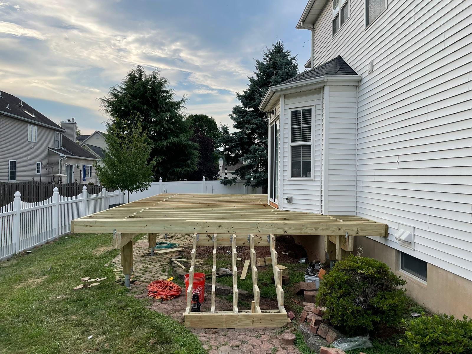 New Deck with Pergola and Vinyl Lattice by deck guardian