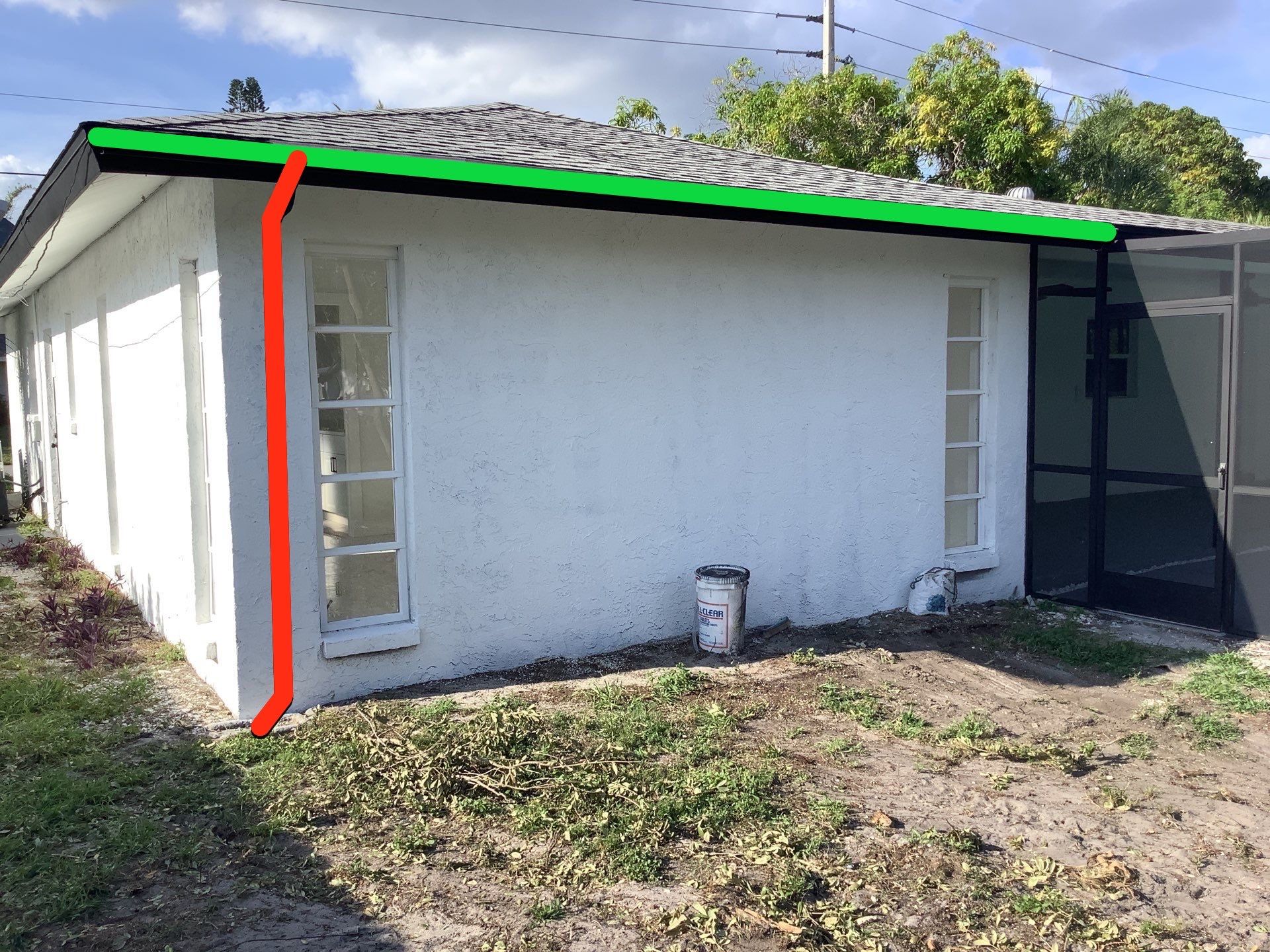 Black seamless gutters and downspouts installation in Sarasota, FL by Gutter Professors