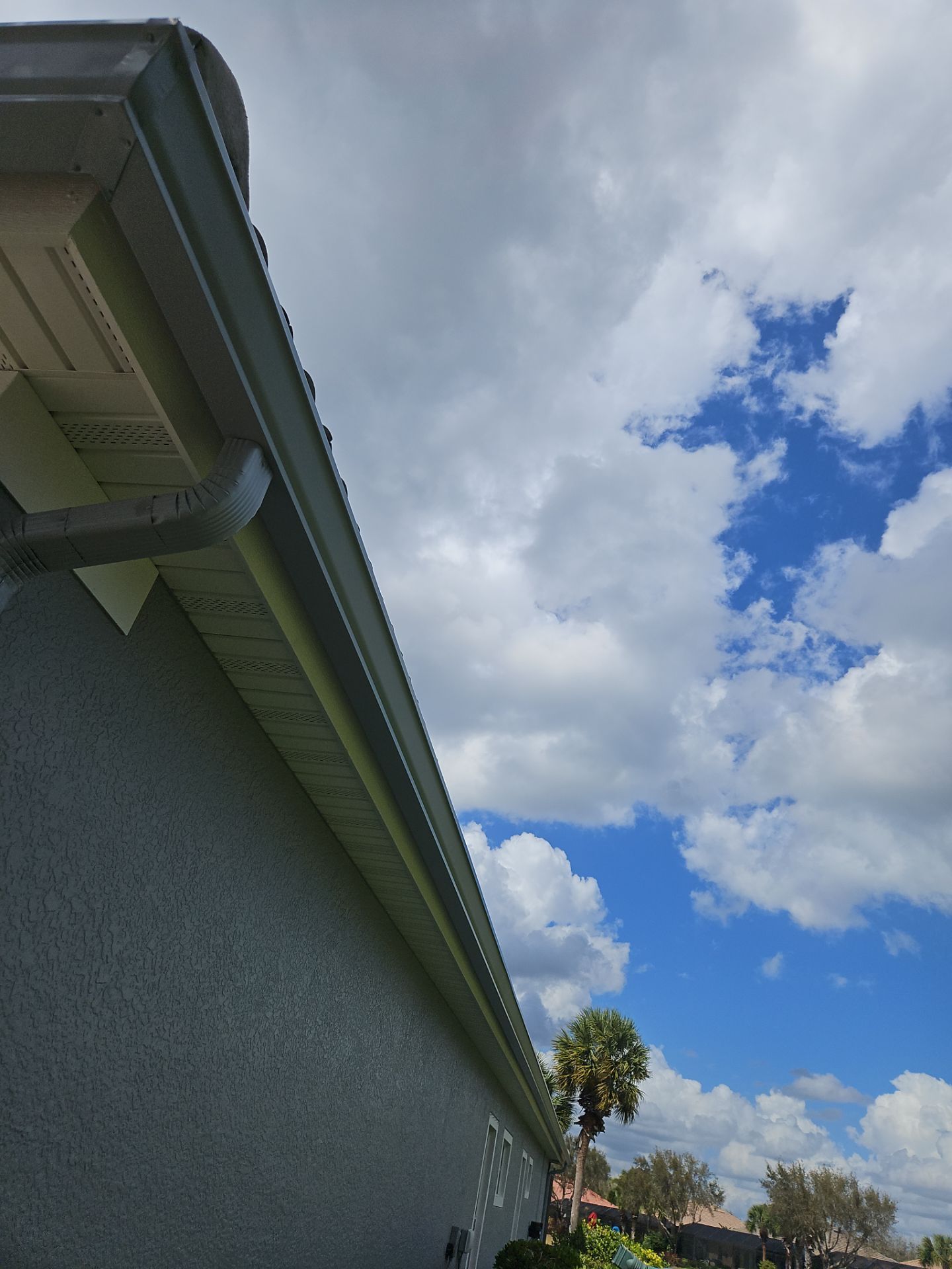 6-inch K-style Seamless Gutters and Splash Guard in Grey Color in Naples FL by Gutter Professors