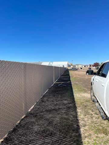 Light Commercial using 6' chain link with slats by Valley Fence Company