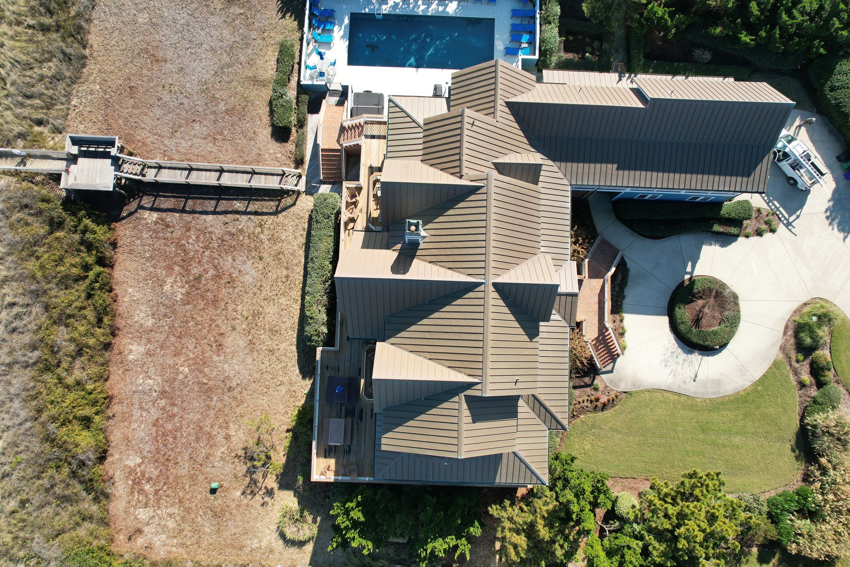 Large Metal Roof Transformation by Gallop Roofing & Remodeling, Inc.