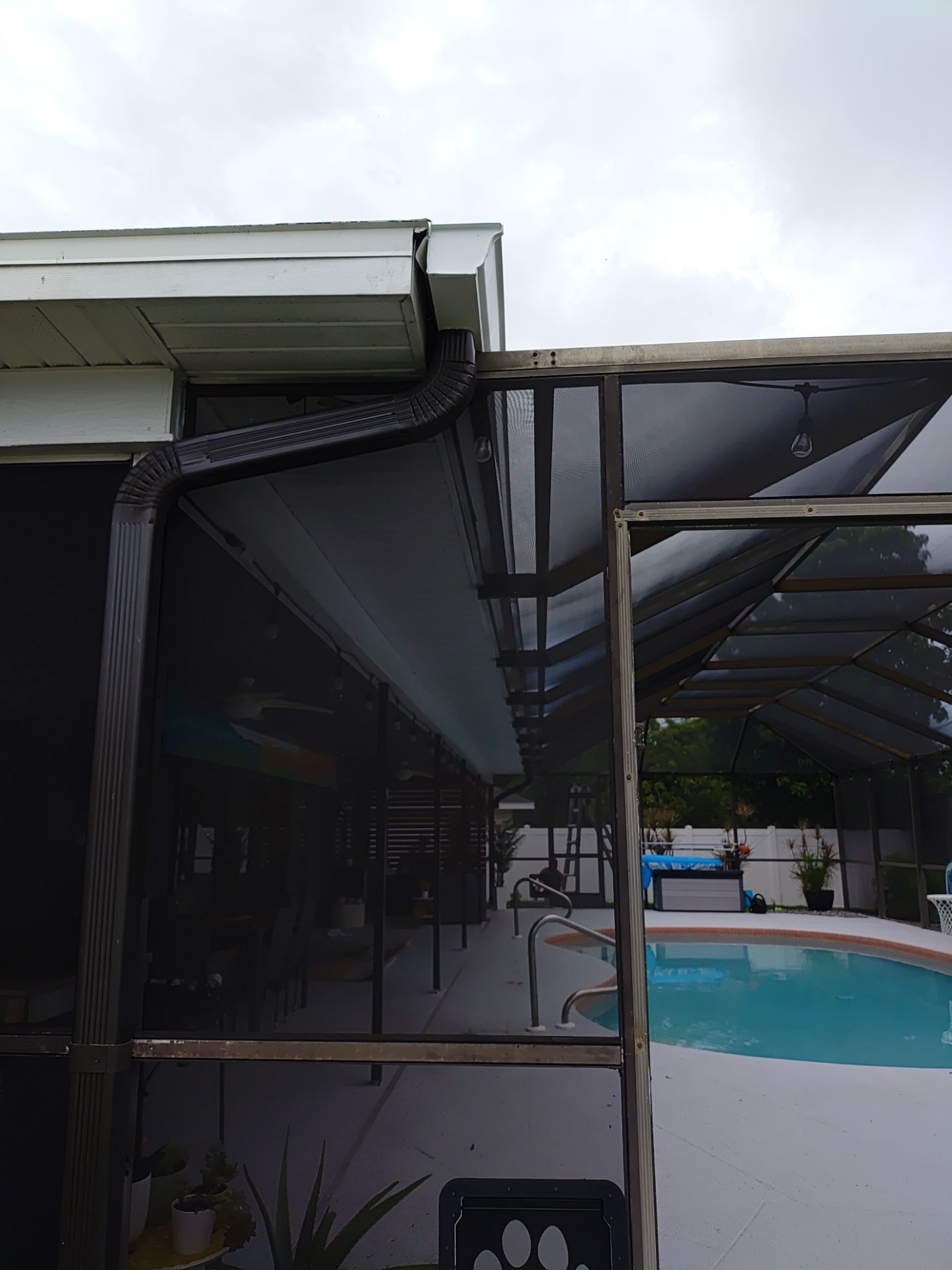 3x4 Downspouts Bronze Installation in Cape Coral FL by Gutter Professors